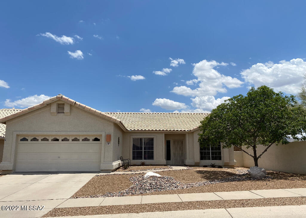 A pretty modern-style home in the attractive and peaceful Sunset Cove subdivision.  Lovely views of the Rincon Mountains from most rooms of the house.  Beautiful views of both the Santa Catalina Mountains and the Rincon Mountains from your own backyard.  The entire home has been updated and refreshed.  Updates include all new matching slate appliances, new paint, new baseboards, new lights, new ceiling fans, new toilets, new garage door opener with battery backup, new bedroom carpet, and much more.  Recently, the house had ArrowSeal duct cleaning and duct sealing for cleaner air and lower energy costs.  This home is close to both shopping/dining opportunities and nature activities.