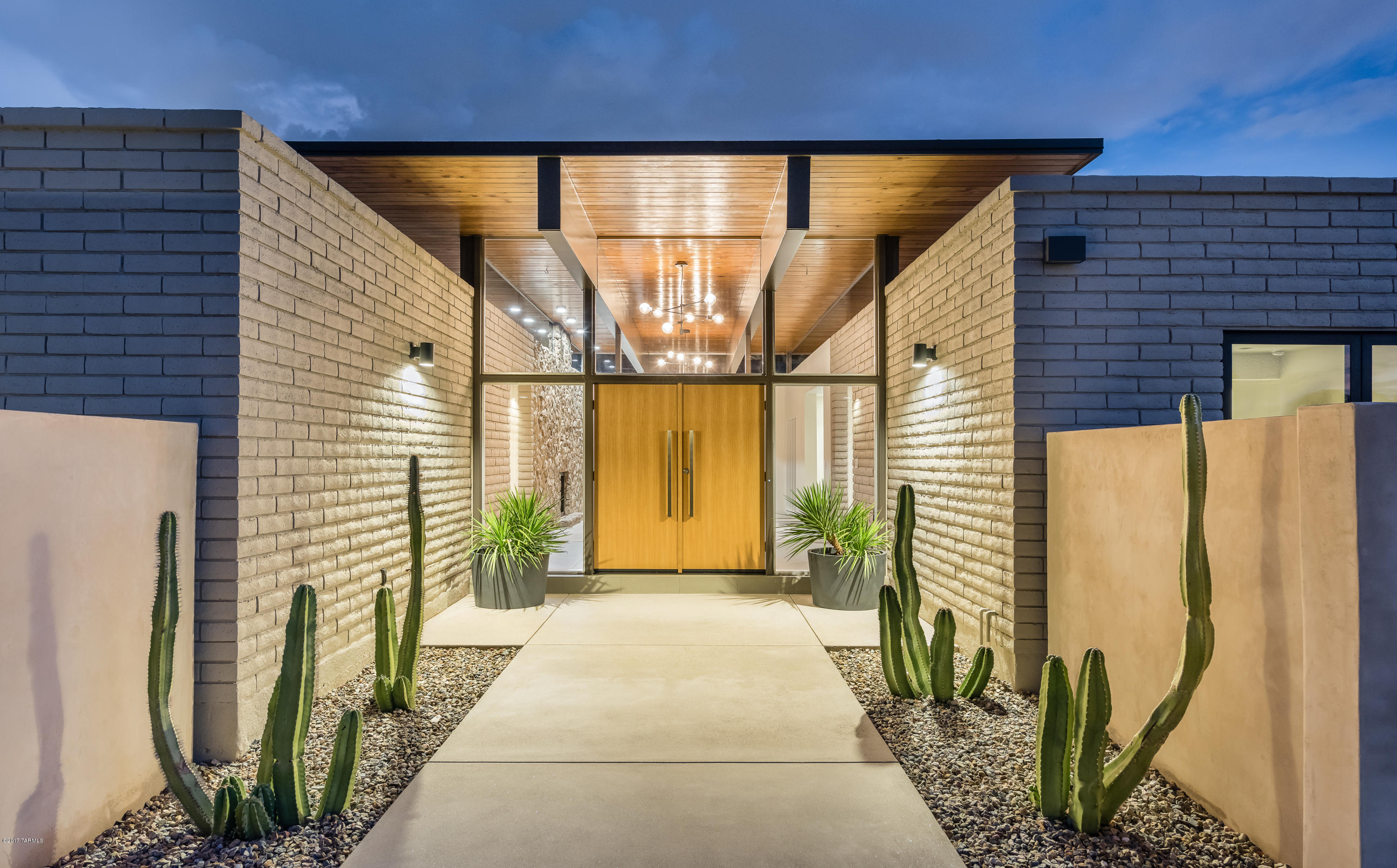 This totally renovated mid-century modern hilltop home must be EXPERIENCED. The dramatic entrance reached from the east driveway hints at what’s to come: cedar ceilings, exposed beams, expanses of glass, and 360 degree views of the city and mountains. Delight in the ultra-sophisticated kitchen with 2 dishwashers. The joy of cooking is at your fingertips—if you can take your eyes off the view. From the master suite, glide through the pivot door for laps in the pool, soak in the free-standing tub, or rejuvenate your senses in the private steam shower. The home is perfect for a single family, multi-generations or the hostess with the mostest. Living area is entirely on one level. The west driveway leads to a 4-car garage and separate service entrance. No HOA fees. Agent is related to Sell