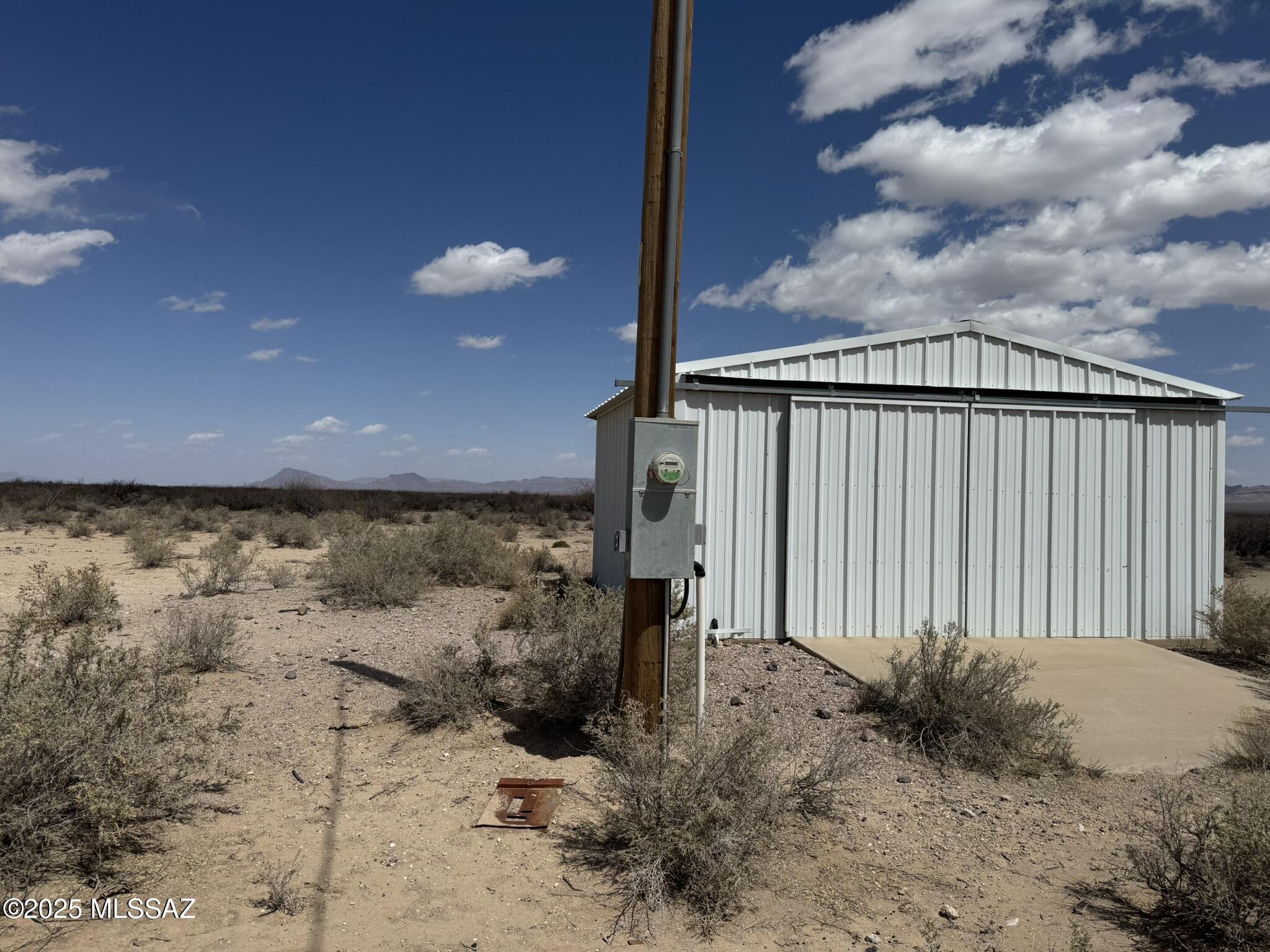 Almost 80 acres zoned RU-4 and FEMA Zone X. An outbuilding on the property. County maintained dirt road is easily traversed. Enjoy mountain views by day and dark skies sparking with countless stars by night. Electric on property and a private well, registration number 55-210597.