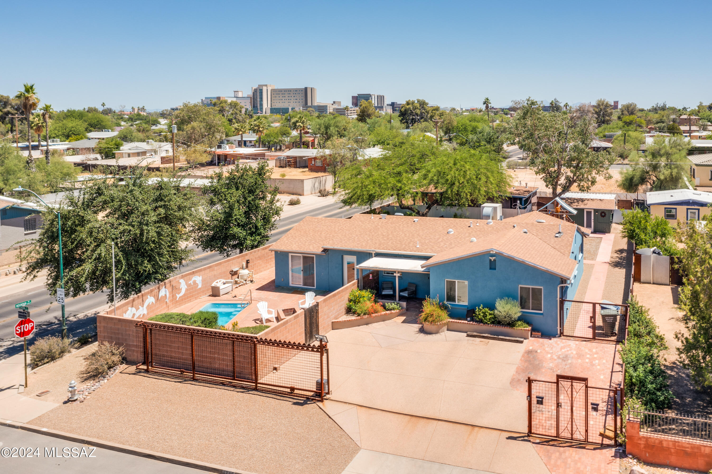 Opportunity is knocking in the desirable Jefferson Park community. Conveniently located on the corner of Edison and Mountain Ave is a  Gorgeous updated 3 bedroom/3 bathroom main house  +  a 1 bedroom/1 bathroom Guest house. Property is completely enclosed with block and custom metal fencing with electric gates that allows for both ample privacy and secure off street parking.  The Main house offers spacious bedrooms, updated bathrooms, an office/den, professionally landscaped private yard with a sparkling pool to cool off in the summer. Charming Exposed wood beam ceilings.  Kitchen is nicely appointed with stainless steel appliances, butcher block countertops, farmhouse style sink and is open to dining.   Ceramic wood tile plank floors in the main living area. There are multiple closets f extensive storage (including one cedar lined closet) through out the home. Double pane windows, pre-wired for indoor/outdoor speakers, 200 amp electric panel, interior pipes were replaced including the main water line in 2014, new shingle roof 2019.  The 1 bedroom/1 bathroom guest house, built in 1999, provides a private enclosed yard with front covered porch, gate secured off street parking with a 2 car carport, ceramic wood plank tile throughout,  an open concept full kitchen with adorable  living room and electric fireplace.  The bedroom is generous in size and features an en suite. Exterior door from the bedroom leads to an additional covered patio and access to a laundry room and storage.  This is a must see in person to truly appreciate all the hard work and updates through out. 
Electric and Gas are separately metered.