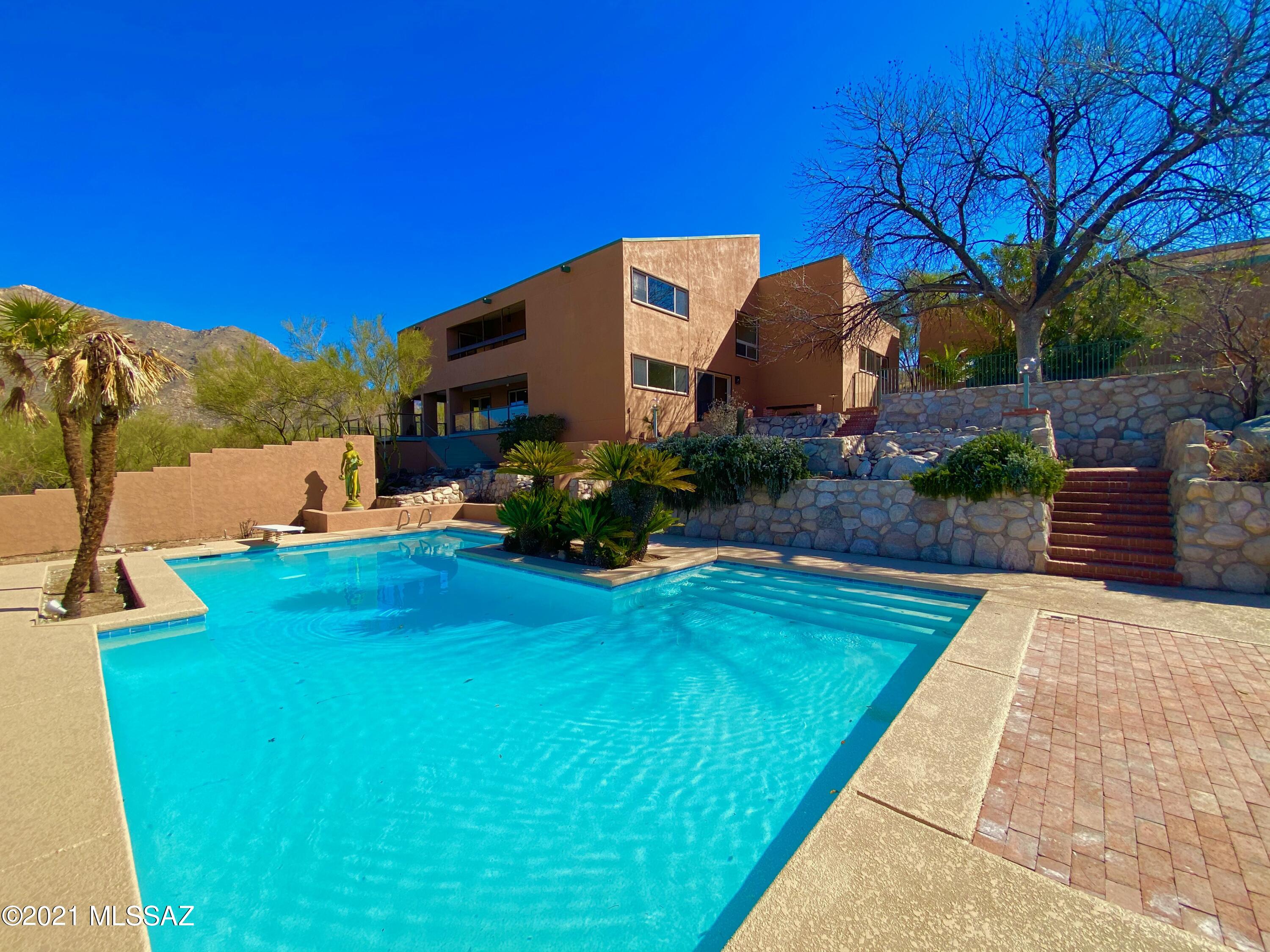 Amazing 3885 SF home on 6+ acres in Cobo Catalina Hills with spectacular 360 degree views. Large viewing windows let ample light in throughout the house. Updated kitchen with brand new KitchenAid stainless steel double oven, cooktop and dishwasher - and Quartz countertops. Four bedrooms plus office and game room. Master bedroom with fireplace and separate sitting room with balcony over living room. 2-car garage and separate 3 car garage with add'l workshop and lift on one side! Bonus studio attached to 3 car garage. Afternoon sun keeps the west-side pool nice and warm.  So much storage and space!