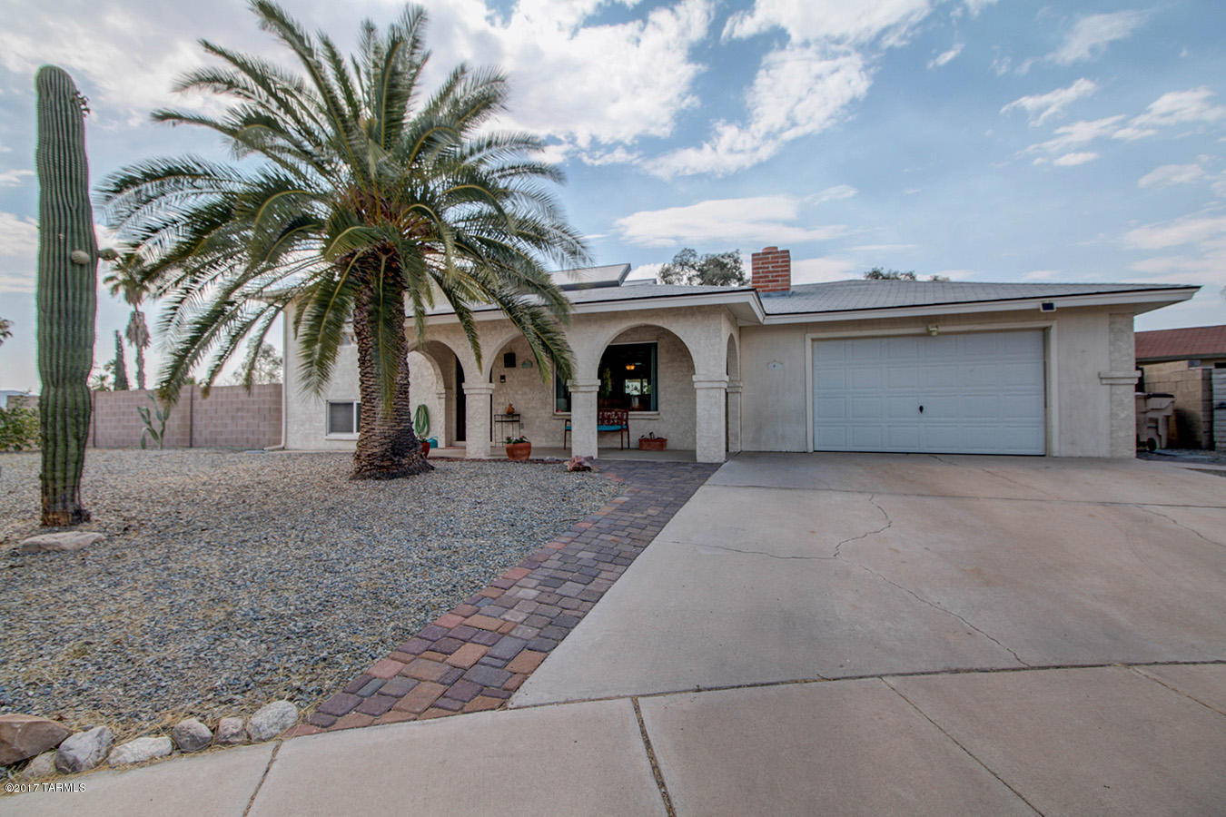 Seller will accept or counter offers between $199,900-209,900. A True Gem in the Marana school district! This tri-level home is ready for new, loving owners! Enjoy the open living room and dining area as you look out on the backyard oasis... the sparkling pool, built-in bar, open space.... it'll make you feel like you're always on vacation! This lovely home has  2 spacious bedrooms on the top floor, with freshly painted bathroom and plentiful closet space. Open and bright living room with fireplace, updated kitchen and dining room on the middle floor. Bonus room w/ bedroom on bottom floor - could be guest quarters or master suite! Newer Dual pane windows and Solar hot water heater. Back yard could accommodate RV Parking. All appliances stay!
