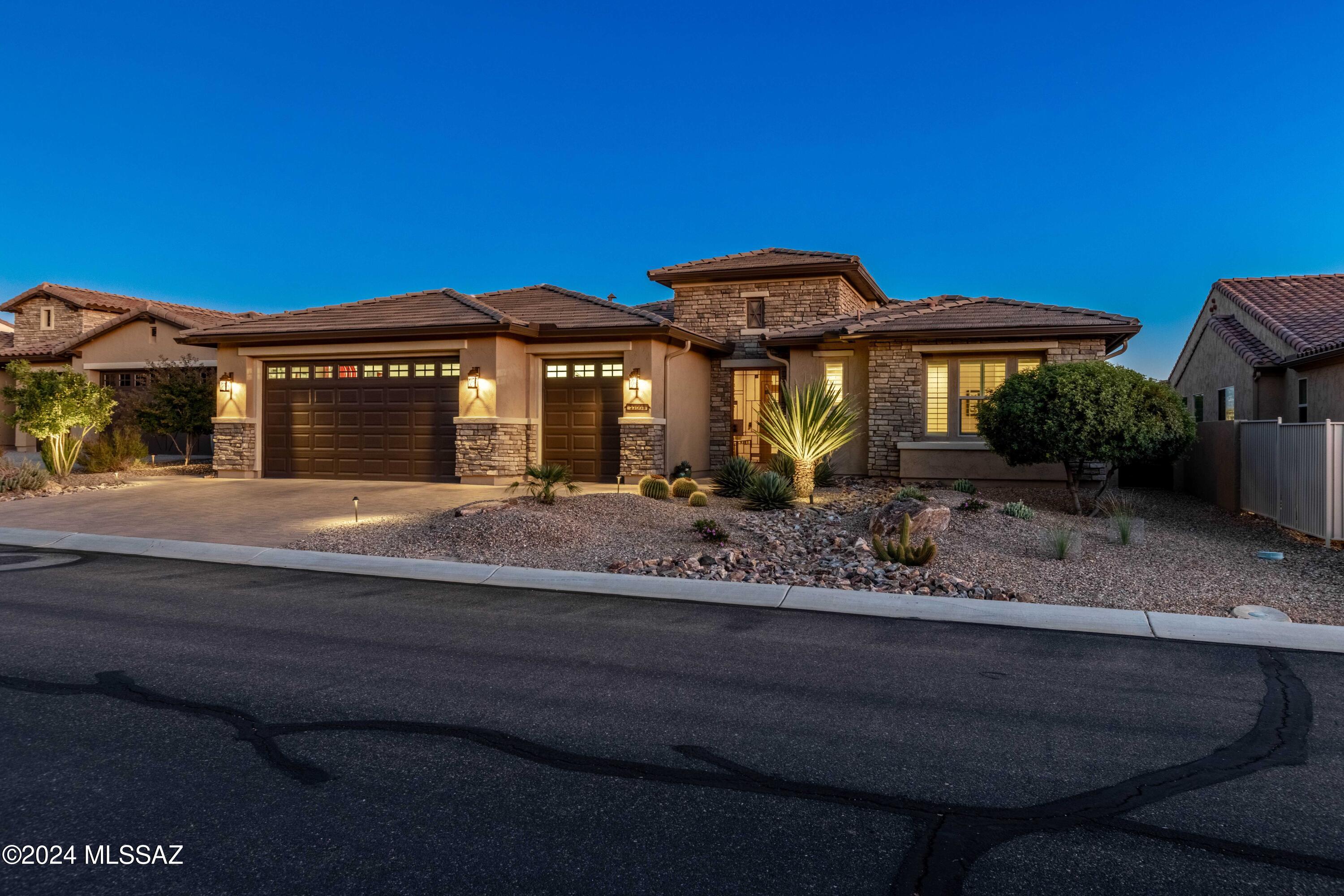 Welcome to this stunning Tesoro model home in the highly sought-after SaddleBrooke Ranch resort community. This exquisite property offers breathtaking views and a luxurious living experience. The home features 2 bedrooms plus a versatile den and is loaded with premium upgrades throughout.
Inside, you'll find quartz countertops, elegant wood tile floors, and plush carpeting in the bedrooms. The chef's kitchen with its walk-in and butler's pantries opens to the large great room and makes this home an entertainer's dream. 
The spacious garage includes the optional 4-foot extension, and the separate bay for your golf cart or additional workspace / storage. The home features a whole-house water softener system, and recirculating pump on the water heater. Welcome to this stunning Tesoro model home in the highly sought-after SaddleBrooke Ranch resort community. This exquisite property offers breathtaking views and a luxurious living experience. The home features 2 bedrooms plus a versatile den and is loaded with premium upgrades throughout.
Inside, you'll find quartz countertops, elegant wood tile floors, and plush carpeting in the bedrooms. The chef's kitchen with its walk-in and butler's pantries opens to the large great room and makes this home an entertainer's dream. 
The spacious garage includes the optional 4-foot extension, and the separate bay for your golf cart or additional workspace / storage. The home features a whole-house water softener system, and recirculating pump on the water heater.   
The open living space includes a stylish wet bar with a beverage refrigerator, perfect for entertaining. Step outside to the inviting back patio, complete with a cozy gas fireplace a perfect spot to unwind and enjoy the unobstructed views of the Catalina Mountains, Mount Lemmon and Pusch Ridge. This Tesoro model combines luxury, functionality, and comfort in a truly desirable resort location.