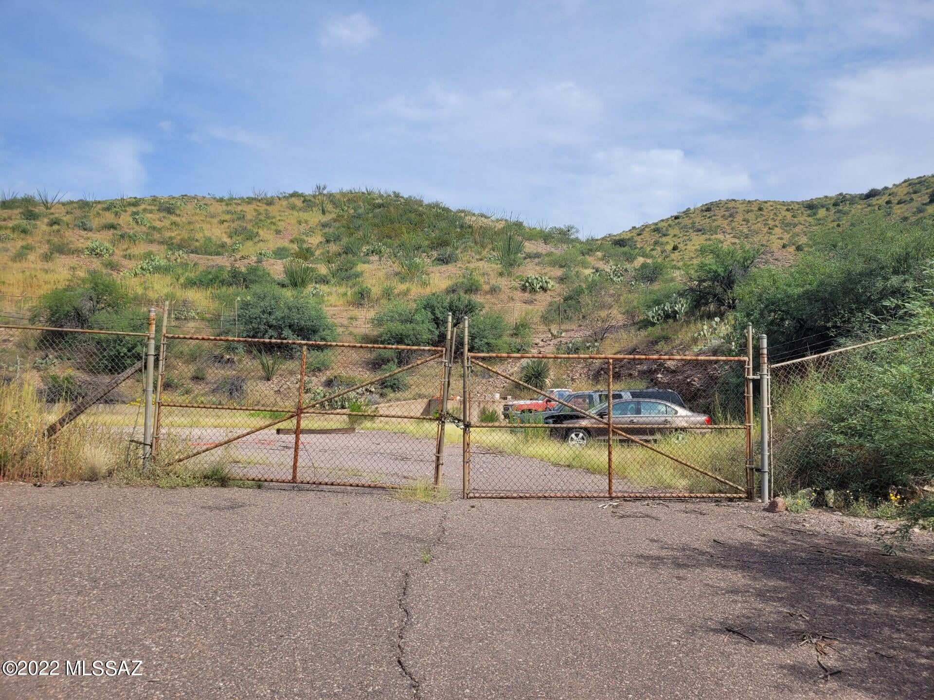 .69 Acres of Commercially Zoned property located on the 191. Property has abandoned storage facility partially torn down.  All motored vehicles will not convey with property, and will be removed before close of escrow.  Travel trailers on property can convey if buyer would like to keep them.  Gas Easement runs through property.