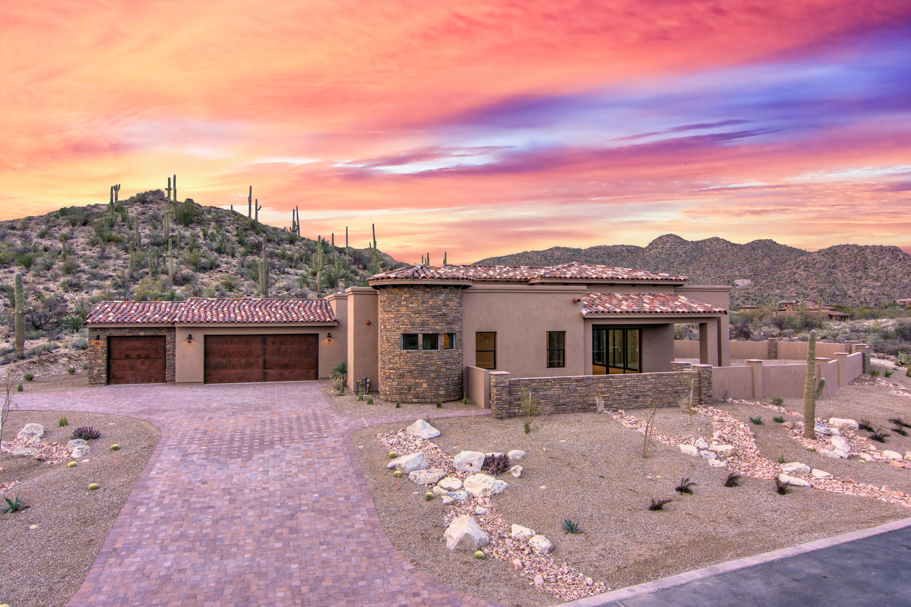 Tuscan inspired with an expansive Great room floor plan in this new 2644 sq.ft. Pisa I series, designed with flowing living spaces, high ceilings with dual sets of 8' four panel sliding glass doors in the Great room opening to the two large covered patios and BBQ; Great Room opens to the fully equiped gourmet kitchen and Nook. Master suite with dual vanities and a spacious closet, plus two additional bedroom suites for visitors or family members. Indoor and outdoor living are highlighted with Catalina Mtn. views from two covered patios, and a large three car garage with rustic paneled doors. See MORE Tuscan Estates is an integral part of Stone Canyon, a private community with enhanced features of golf on the new Mickelson property, complete with a new 25,000 square foot clubhouse, all surrounded by the dramatic desert setting of rock formations, desert sunsets, and its great location.