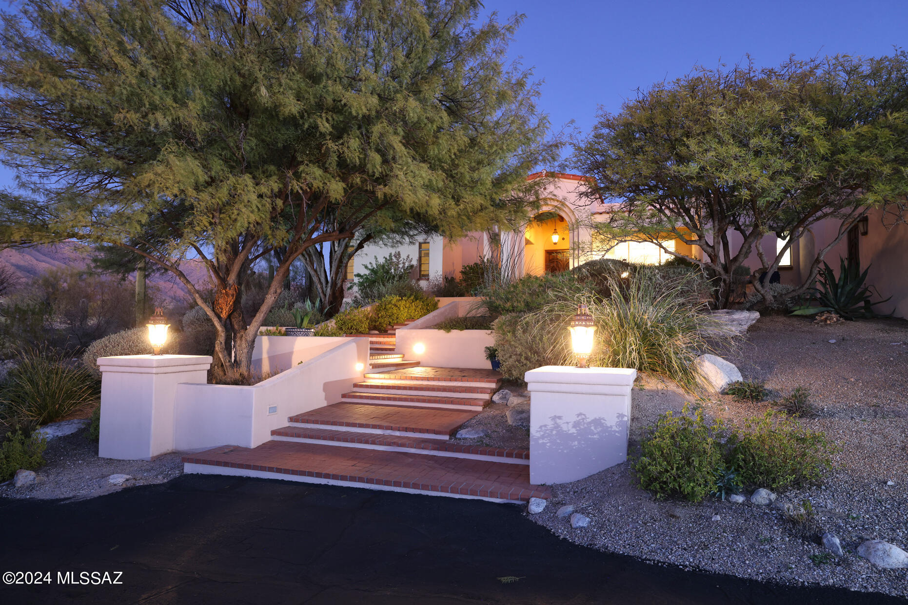 First time ever available. The crown jewel of the Foothills. Stunning custom masonry La Quinta home on absolutely the finest 1.4 Acre ridge top lot in guard gated Catalina Foothills Est. #10. Unparalleled views from every window, the Catalina Mountains & Finger Rock to the north and the entire Tucson valley & 4 mountain ranges to the south. The 3 bedrooms are all en-suite including 2 baths, 2 walk-in closets, fireplace & laundry in the Primary suite. The dining room is capable of entertaining all your favorite people. Expansive great room with three statement sized arched windows, built in cabinetry & massive brick fireplace. Stunning hardwood floors give this home a classic  warmth, Large eat-in chefs kitchen. Enormous covered porch looks out at the sparkling pool & spa. Built in grill.