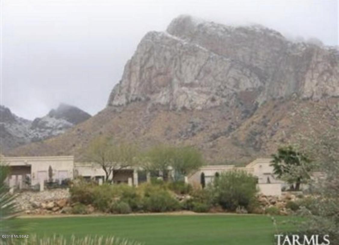 Drive up to your gorgeous home with amazing views of Pusch Ridge; your guests will pull up to the extra blacktop parking area facing mountains, entering a patio space & YOUR NEW HOME! Custom designed & built by Tamarron Homes, w/ features expected in 35 yrs. of craftsmanship. Cherry wood cabinets w/custom pullouts, granite counter tops & stainless steel appliances, in a spacious cooking/dining area w/ French doors & double pane windows throughout; it opens into two large bedrooms/office & full bath. A spacious sitting area upstairs invites you onto a deck w/spectacular mtn views or Master bedroom & spacious bath w/ custom amenities. Used as a 2nd residence, it's a perfect young executive's home, retirement getaway or investment opportunity for vacation/rentals. Take a hard look & see what