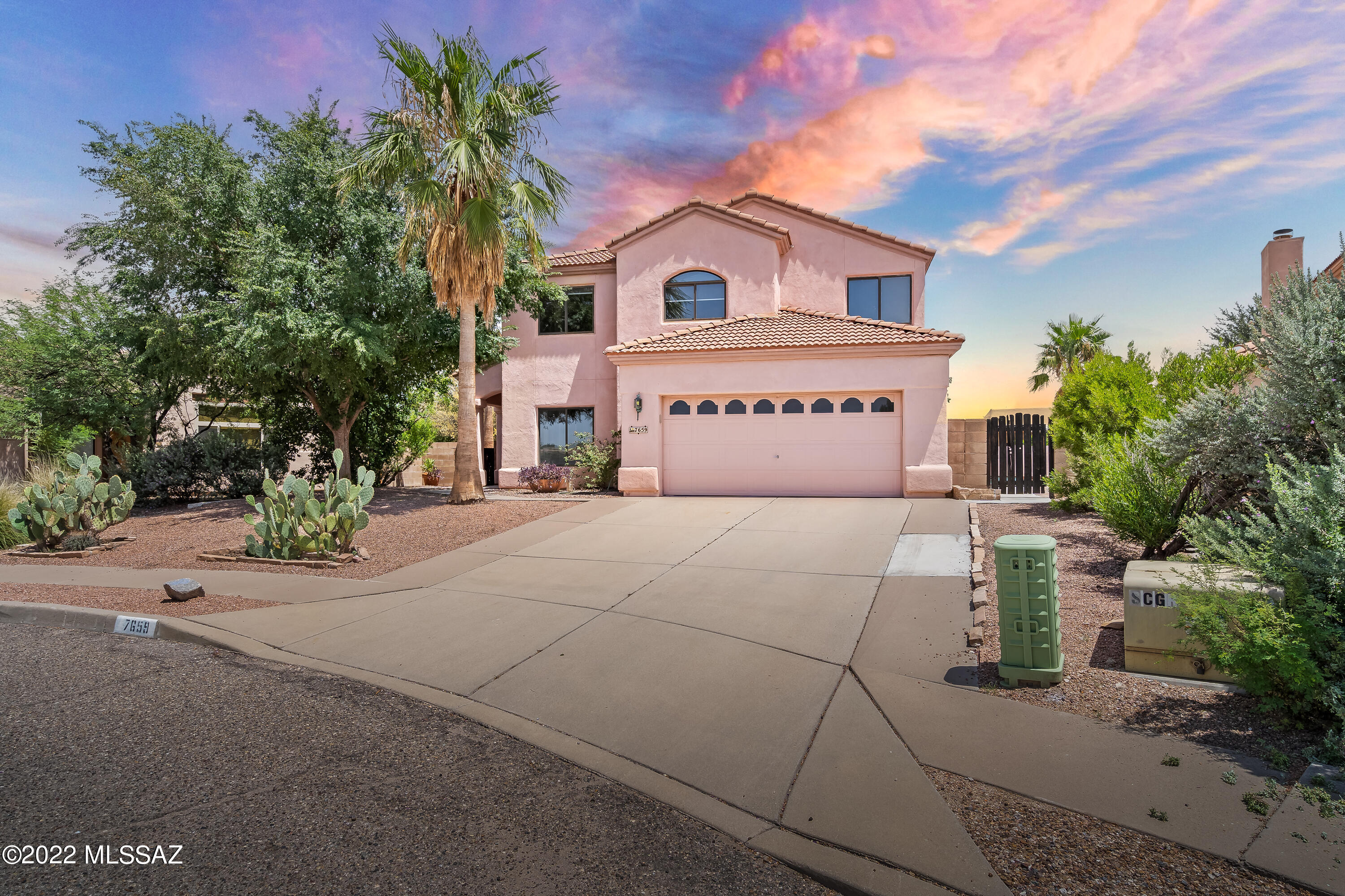 SELLER'S SAID ''GET IT SOLD!'' All offers considered! $100,000 price reduction on this move-in ready 4-bedroom, 3 full baths family home, w/a den, sparkling pool, relaxing spa, & artificial turf for the kids to play!  Newly painted interior T/O, including the garage with loads of cabinet storage space!  The large eat-in kitchen includes 2 wall ovens, 2 large microwaves, & a large kitchen island.  A family/game/rec room with a cozy fireplace, & an extra-large formal dining room.  The huge upstairs master suite includes an oval tub, separate shower, giant walk-in closet, & a sitting deck to enjoy coffee & mountain views!  A new 30-year tile roof, 2 large newer air conditioners, a new hot water heater, a new pool pump w/ 4 new filters, new window blinds in the living room, ceiling fans T/O m & reverse osmosis water systems make this home perfect for the family!  All appliances included!  Plus, it is close to major hospitals, doctor offices, shopping, restaurants, & Udall Park!  An 8-month American Home Shield Warranty policy is included!  What's not to like?  Show & sell!