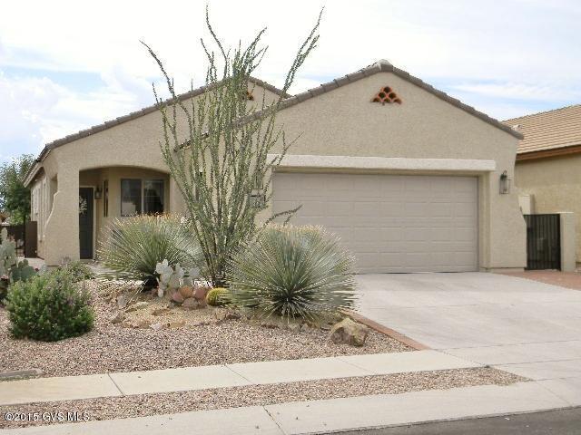 Upgrades, upgrades and more upgrades in this beautifully appointed home in a 55+ community.18inch tile and Cherry floors throughout this home. The spacious kitchen has Corian counter tops, gorgeous oak cabinets and an eat in area perfect for 2 people. The master has a bay window that lets in tons of AZ sunshine and adds to the spaciousness of the room. The master bath has been completely redone, with walls moved to add additional room. With granite counter tops, an amazing multi-head glass shower and custom floors, you'll feel like you're in a spa everyday! Outside the home has a 2 car garage with built in storage and an amazing back patio with pavers leading to a cozy fire pit. Come see how retirement was meant to be!!
