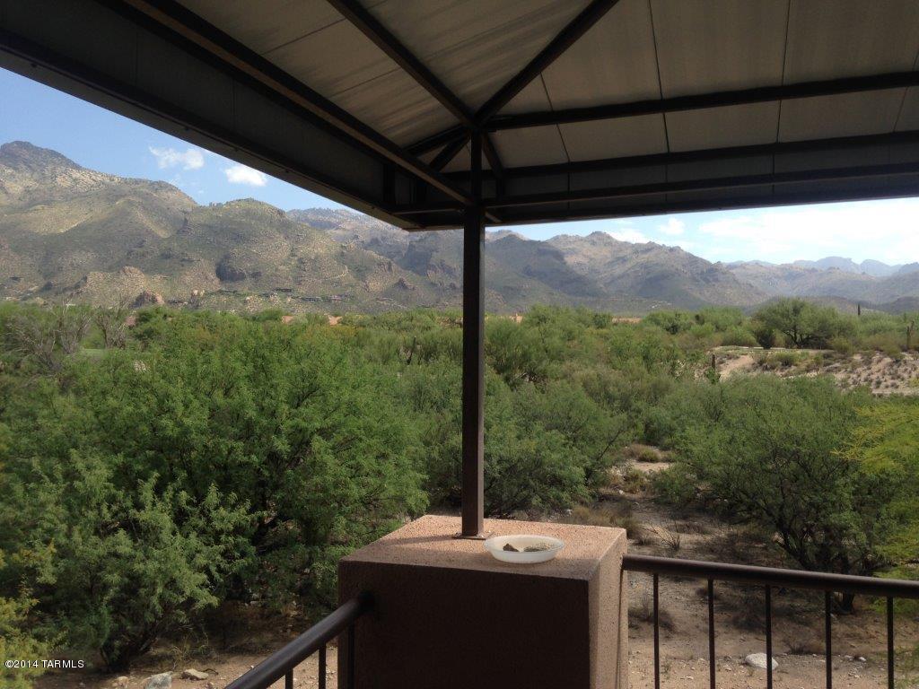 Spectacular mountain and golf course views await you from your own private balcony in this spacious 2 bedroom.  Located at The Greens, sharing the same magnificent grounds as the world famous Lodge at Ventana Canyon, this unit provides everything you need to enhance your lifestyle.   All new appliances throughout with washer and dryer in the unit. Covered parking space.  Within close proximity to many school, shopping and dining options. Many amenities, including 3 sparkling pools and state-of-the art fitness center.