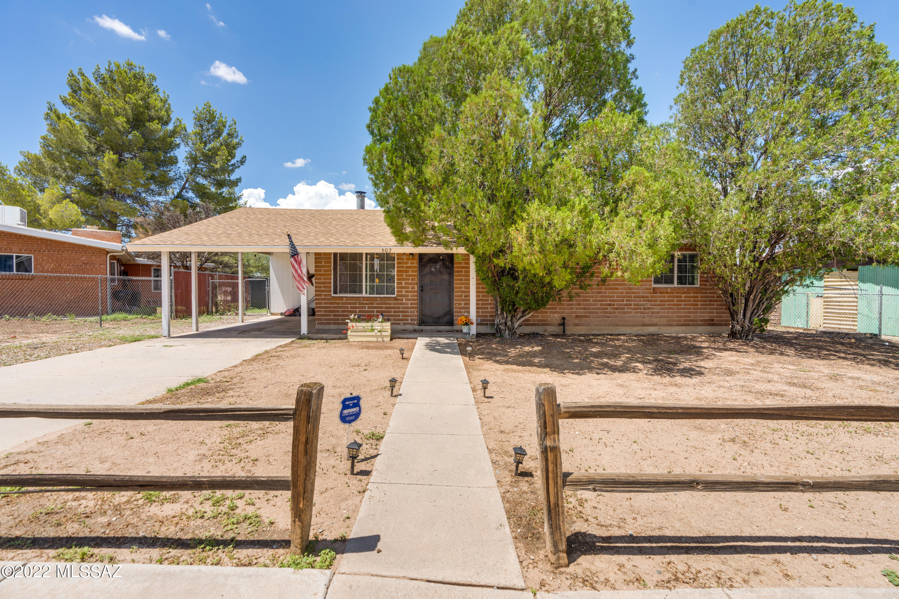 Located in the heart of Benson, minutes from Benson Schools, this recently remodeled home is ready and waiting for you! It's quaint floor plan with wood burning stove has been updated with modern touches like wood laminate flooring, butcher block counter tops, dual pane windows, french doors, a farm house bathroom sink and newer ceiling fans. This bright and open 3 bed 2 bath 1461 sqft home also features ceramic tile, kitchen island, walk-in shower in second bathroom, two car carport, large backyard with privacy fence and is an easy commute to Tucson or Sierra Vista. There is a concrete driveway and plenty of space to park your RV or add storage. The front or back yard is perfect for enjoying the beautiful AZ weather! Don't miss this opportunity. Call today to schedule your showing!
