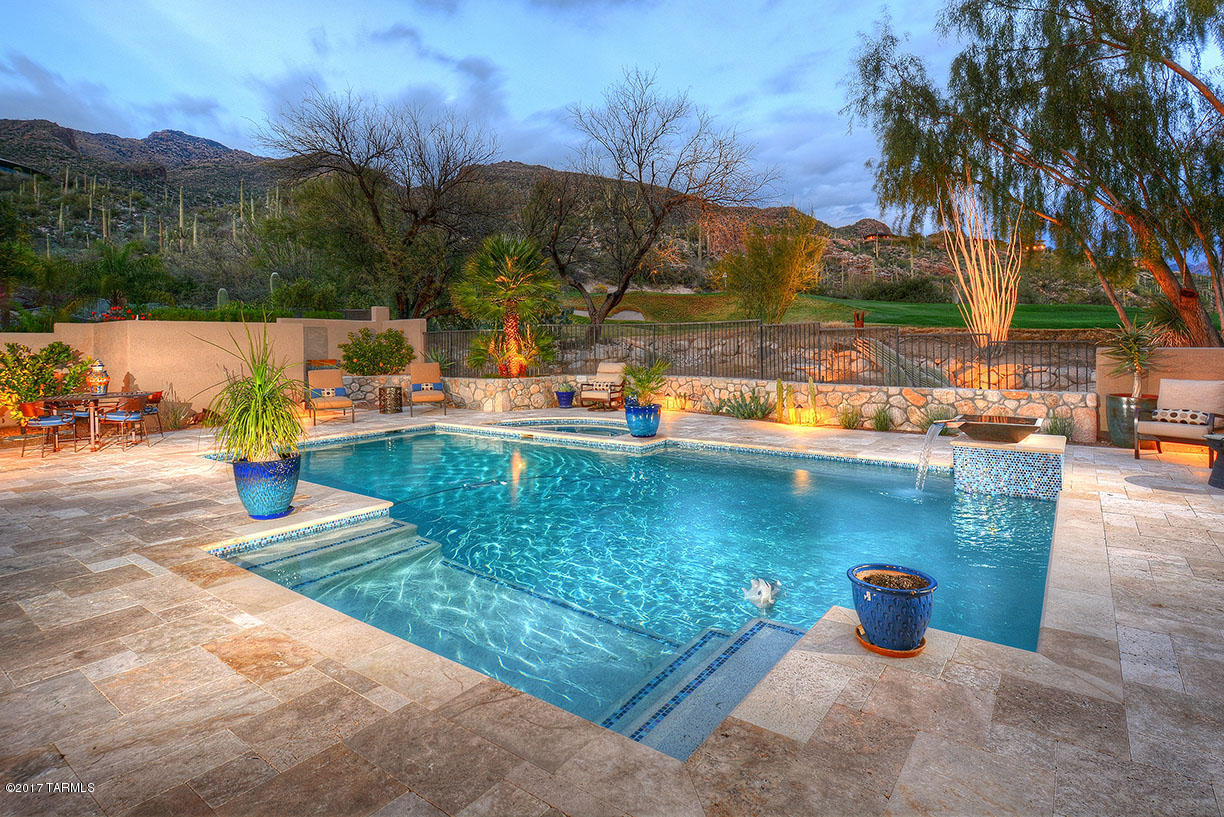 SPECTACULAR HOME NESTLED AT THE 2ND HOLE OF THE PRESTIGIOUS VENTANA CANYON GOLF COURSE OFFERING EXCEPTIONAL SANTA CATALINA MOUNTAIN VIEWS, IMPRESSIVE INTERIORS & THE FINEST OF FINISHES - PERFECT FOR THE DISCRIMINATING BUYER. LUXURY LIVING AT ITS BEST WITH RESORT STYLE BACKYARD, REFRESHING POOL & SPA W/WATER FEATURE, GAS BBQ, EXTENDED COVERED PATIO & MULTIPLE OUTDOOR SEATING AREAS. THIS SOLID MASONRY HOME OFFERS 4 BEDROOMS & 3 BATHROOMS, SPACIOUS LIVING & DINING AREAS WITH SOARING CEILINGS, 2 WAY GAS FIREPLACE, GOURMET KITCHEN WITH CHISELED EDGE GRANITE & SUB-ZERO REFRIGERATOR WITH GLASS DOORS, NATURAL STONE TRAVERTINE FLOORS, SOLID KNOTTY ALDER WOOD DOORS, PLANTATION SHUTTERS, SUN SHADES, COATED GARAGE FLOOR, NO INTERIOR STEPS, 24 HOUR GUARD GATED COMMUNITY. TRULY A REMARKABLE RESIDENCE.