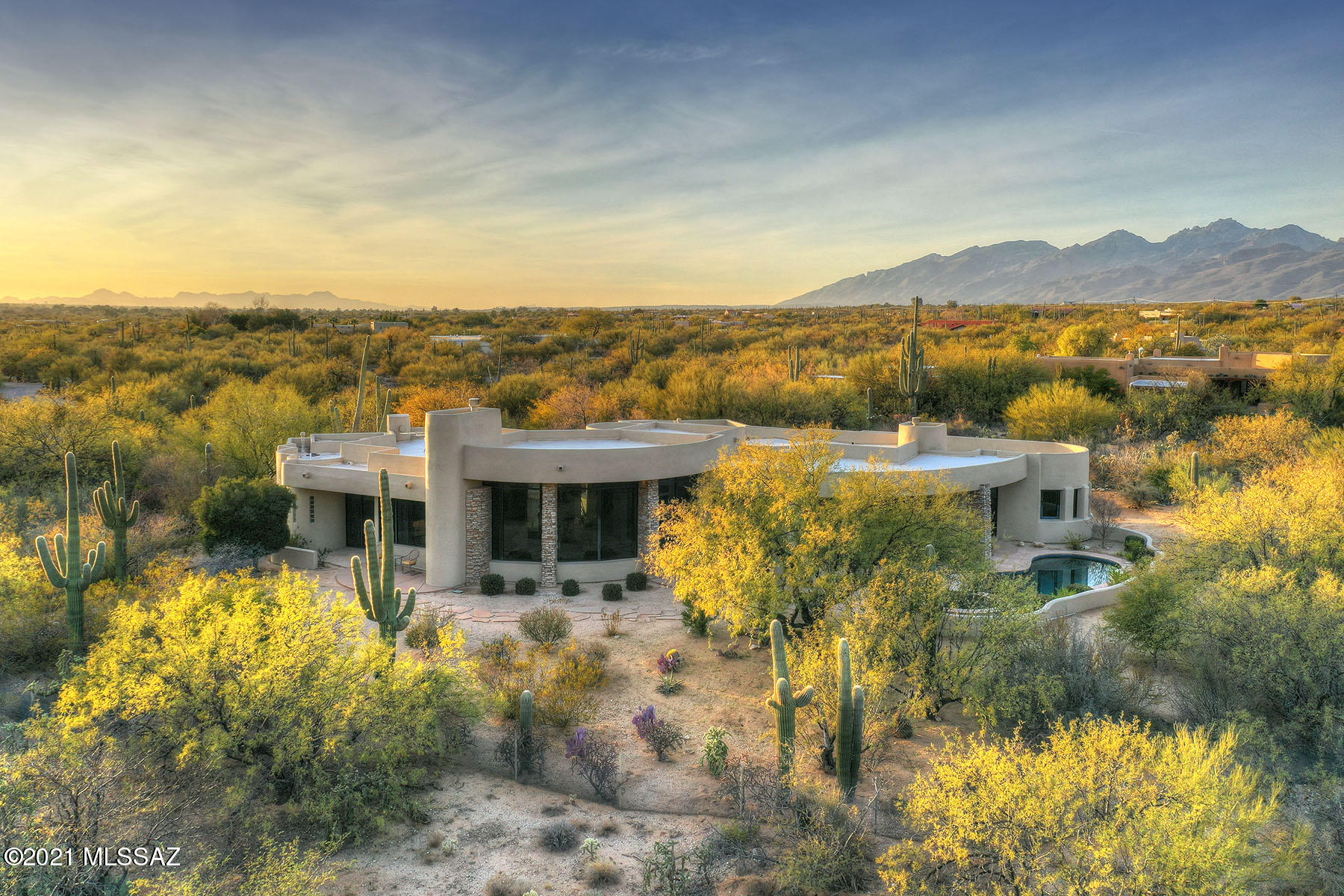 An architectural gem. Privately situated in prestigious La Cebadilla Estates with views so big they bring the outside in from the moment you enter. Renowned architect Kevin Howard and high-end interior designer Lori Carroll crafted this outstanding luxury home in pristine desert at the foot of the Rincons. Expansive kitchen features granite counters, huge island, double ovens, gas cooktop, wine fridge, beautiful alder cabinetry & more. Owner's suite has large walk-in closet & resort-style bath. Of the many features, a dream office & an inviting patio with statement fireplace, pool/spa, grill/bar & covered seating. Amazing 2BR/2BA guest casita with private entrances, & kitchenette. Minutes away from Tucson's amenities & National Forest on 3.72 acres of horse property. Wheelchair Accessible.