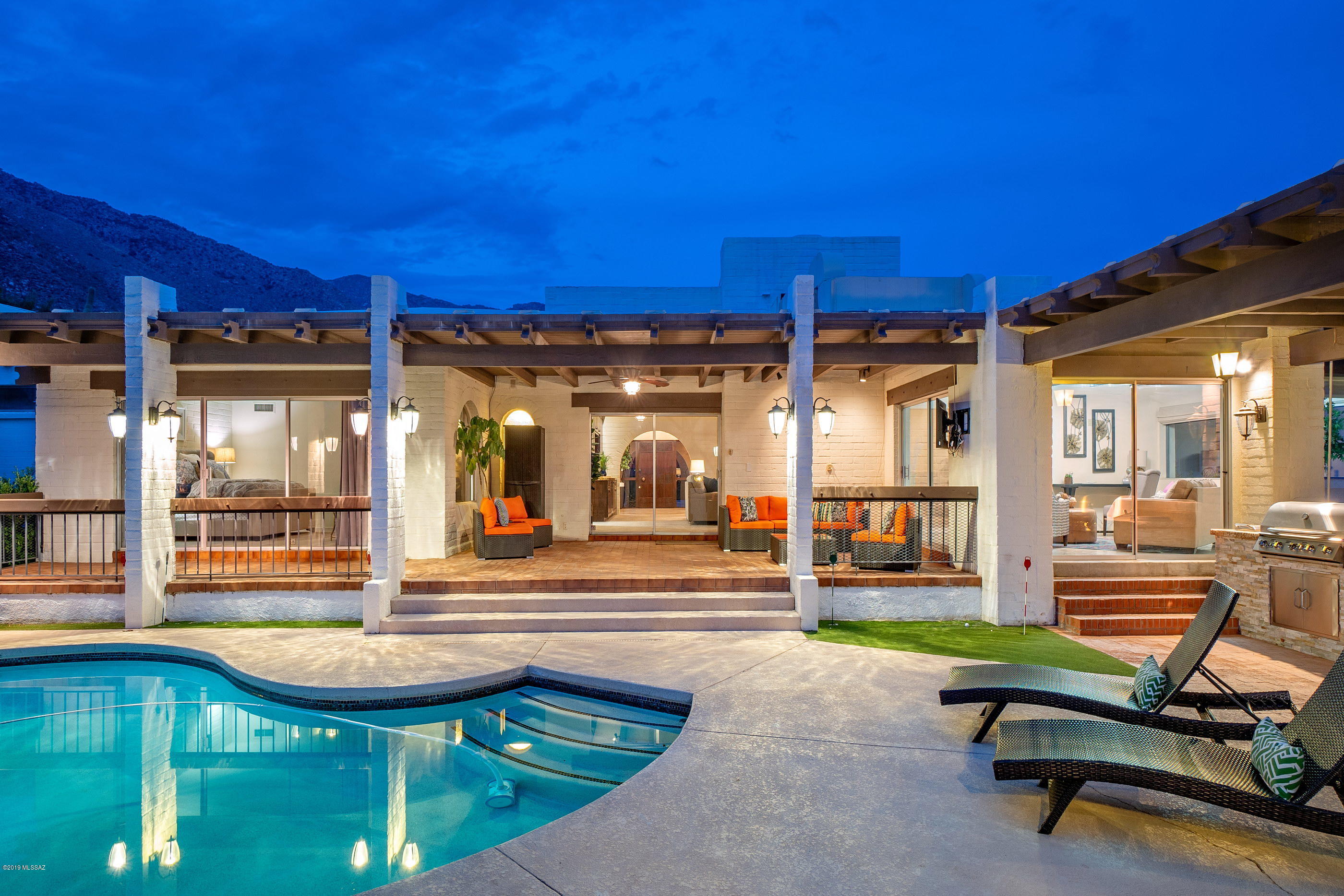 Located in the highly sought after and exclusive guard gated community of Skyline Country Club, offers a home conceived of light and contemporary design, showcasing sweeping city, mountain and golf course views. Sited on a commanding view lot, overlooking both the 10th and 11th fairways, this completely remodeled and stunning home utilizes a delicate balance of contemporary materials, textures and finishes, bringing a sense of elegance to the space. Offering a flexible floor plan with 5 bedrooms and 5 baths (which includes a 560 sq ft private guest en-suite). Striking the right balance of form and function creates a sophisticated yet cozy environment, elegantly updated with painstaking detail. An extensive list of recent updates includes: all new kitchen, flooring, appliances, bathrooms, tile, lighting, painting and more.
 
Evoking family-style living and employing an open-living dining and kitchen area, acting as the primary gathering point. The heart of the home is the fabulous chef's kitchen with gorgeous finishes throughout. Solid custom handmade knotty alder cabinetry, complemented by granite counter tops and top-end appliances, surround the exquisite custom-tailored center island, serving as a focal point in this kitchen of range and proportion. 
 
The breakfast dinette opens onto a spacious Great Room, designed to substantial scale and comfort, flowing seamlessly off the walls of glass to offer an incredible indoor-outdoor living experience. The striking master suite features an expansive, spa-like bath, both voluminous and bright, offering top end fit and finish throughout. 

Enveloping the residence are a number of truly awe inspiring outdoor living spaces, each of which has been thoughtfully positioned to procure the utmost enjoyment of the surrounding city, mountain and golf course views, immersing oneself into the tranquil surroundings. 
 
Seamless indoor-outdoor entertaining while out on the sun-drenched terrace, offering al fresco dining, an outdoor kitchen with barbecue station, overlooking the resort like pool.