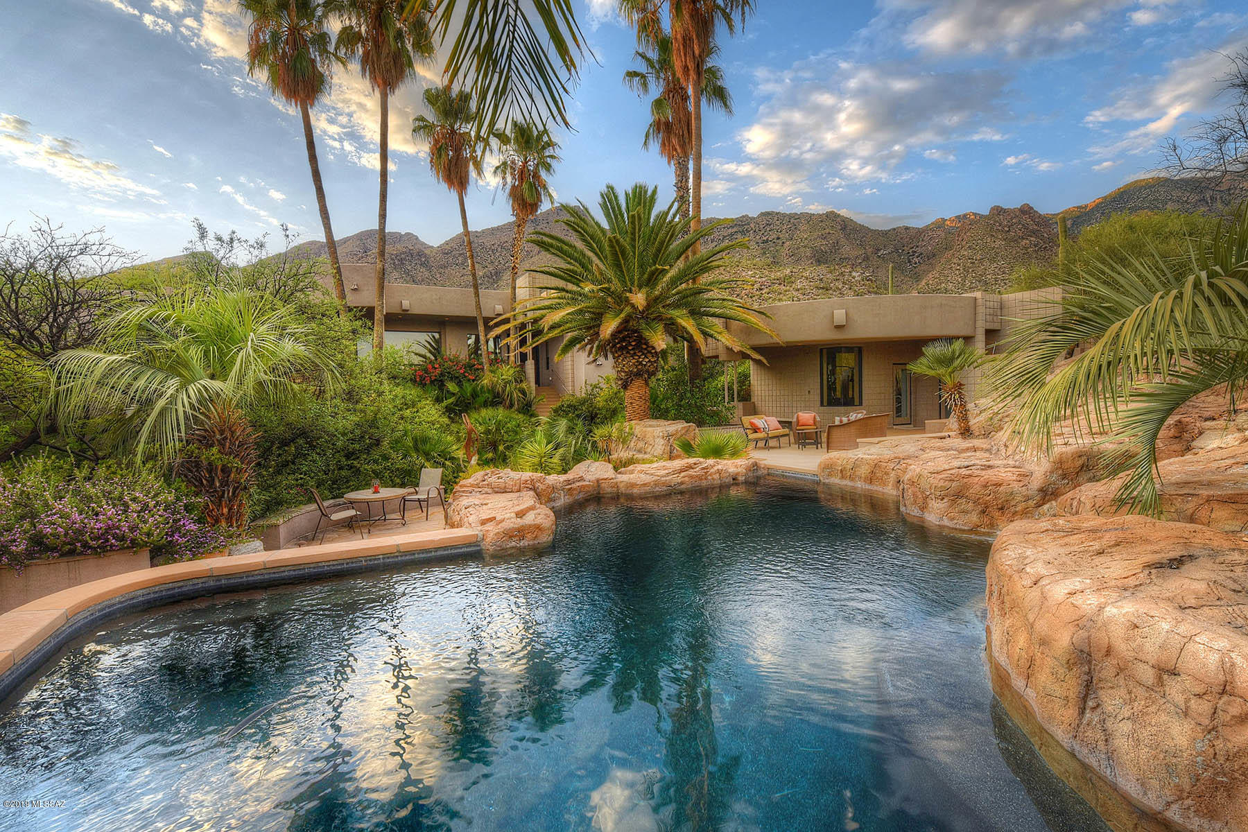 Escape to This 5BR & 8BA Contemporary Compound Situated on an Ultra Private One Acre Lot in The Prestigious Guard Gated Enclave of Finisterra.Masterfully Remodeled by Renowned ID Lori Carroll in 2006-07,This Exceptionally Appointed Home Provides the Perfect Backdrop For Family Living & Large Scale Entertaining.Main House(4943 SqFt) Includes High Ceilings,Walls of Windows,Limestone Flooring,State-Of-The-Art Sound & Lighting,4 Spacious Suites w/Private Baths,Gourmet Kitchen w/Viking Appliances, Discrete Motor Court & 3 Bay Garage.Guest house Features 1BR/2BA,Home Theater,Game Room,Laundry,& Kitchen.Separate Exercise Studio Includes Full Gym & 1BA w/Steam Shower.Lushly Landscaped Grounds w/Cascading Waterfalls,Patios,Kitchen,BB Court,& Salt Water Pool.This is Luxurious Resort Style Living!