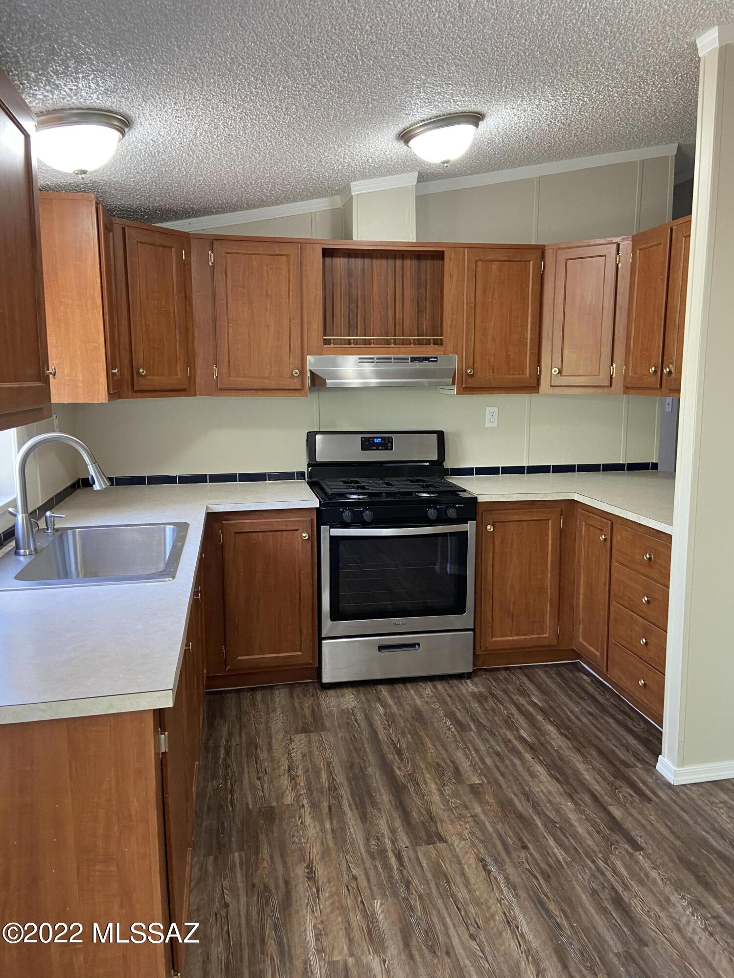 Remodeled home in growing Marana community spacious 3 bedroom   2 bath  home has laminate except bedrooms have carpet, new roof, has a large room could be used as Arizona room not included in square footage.  Enjoy the community park . Has an oversized lot to fit all of your toys. Best of all NO HOA