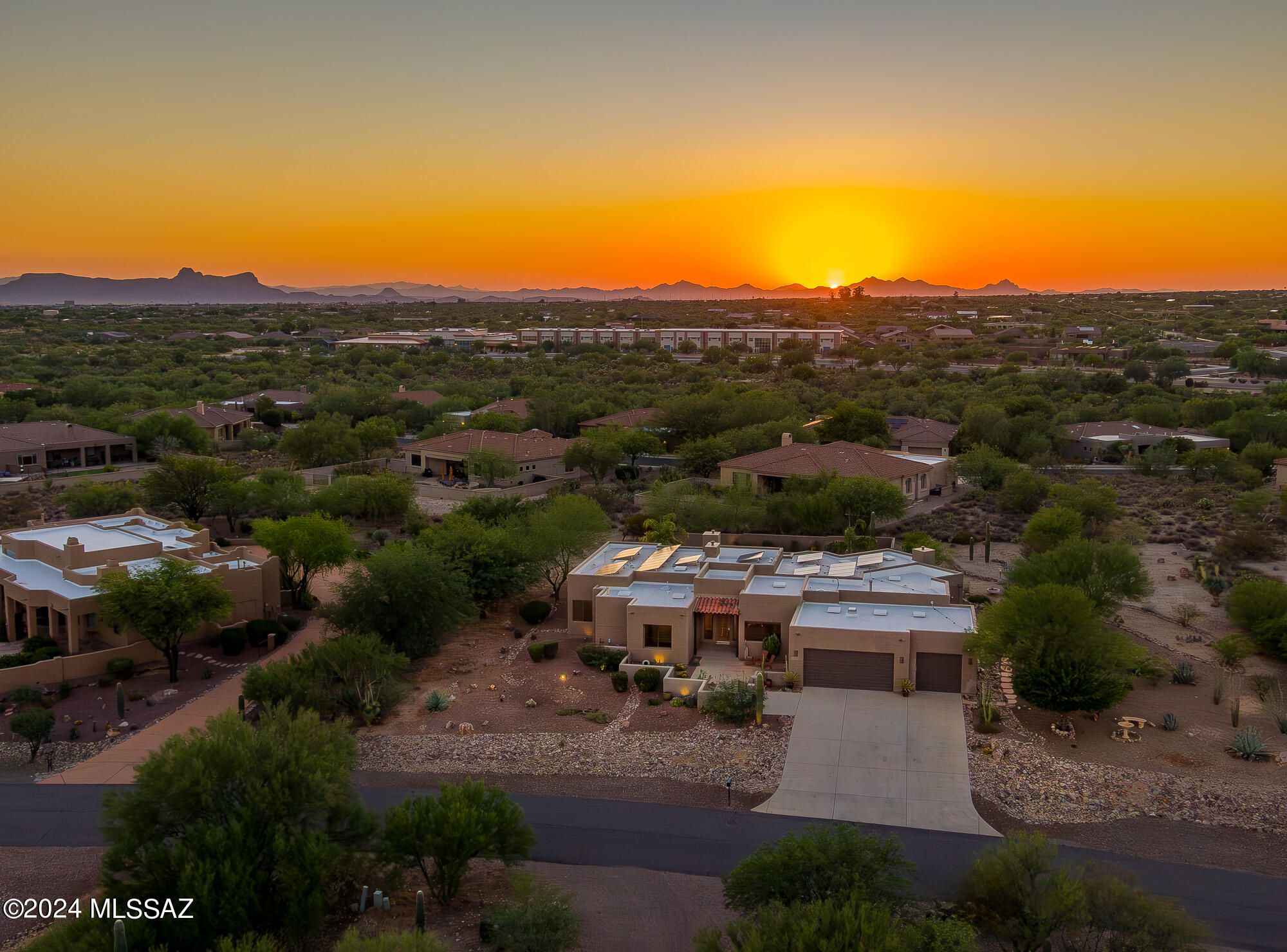 Exemplifying the Arizona lifestyle this semi-custom contemporary home sits on just under an acre, features private, open space & wildlife abound. The open concept plan & attention to detail throughout encourage grand gatherings w/fully equipped wet bar, built-in glass doors that seamlessly blend indoor/outdoor living. Create lasting memories in the luxurious backyard oasis showcasing a comfortable media area, gas fire pit, built-in bbq & sparkling pool w/new heater. The well-appointed kitchen features unpolished stone counters, newer wolf stove & vent hood, custom Alder cabinets w/pull-outs, recessed lights, a large breakfast bar & opens to the relaxing & inviting great room. Lg Primary Suite w soaking tub. Make this your dream home as easy as 12345.