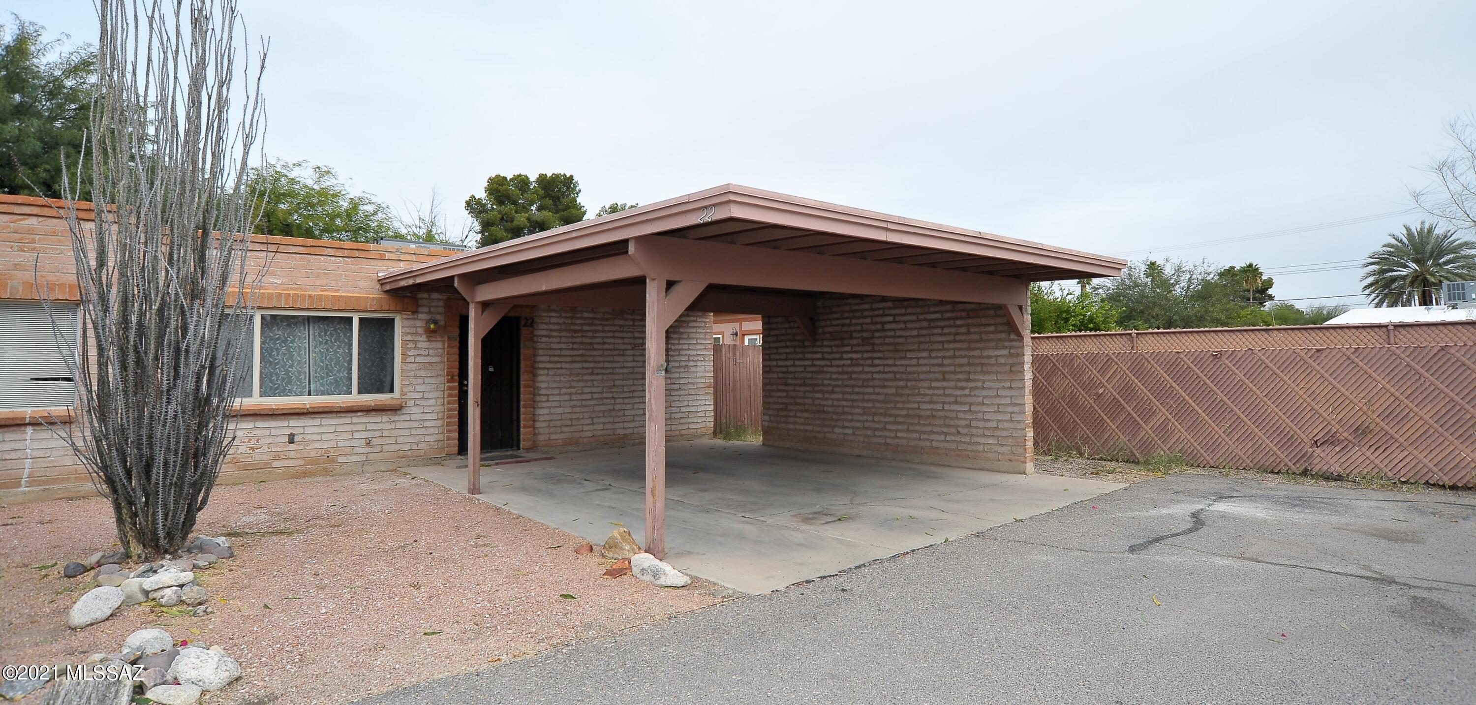 SPACIOUS 2 BD/ 2 BTH TOWNHOME WITH NEW TILE PLANK FLOORING.  NICE SIZE FENCED BACKYARD WITH COVERED PATIO AND STORAGE SHED.  END UNIT WITH LOTS OF PRIVACY. IDEAL LOCATION, CLOSE TO TMC, SHOPPING, U OF A  AND PUBLIC TRANSPORTATION.  HOA COVERS MONTHLY WATER BILL, COMMUNITY POOL, REC CENTER AND COMMON AREA LANDSCAPING.
