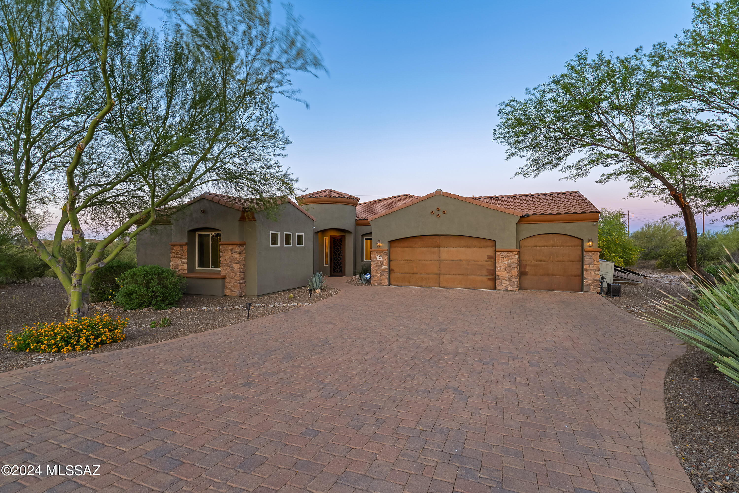 Exquisite, Cornerstone home with captivating mountain views on 3.39 acres in the desirable Silver Shadows cul-de-sac. This immaculately maintained home is full of absolute luxury. Offering a total of 3 bedrooms/3 full bathrooms plus an office/den with double doors and an attached guest quarters/in-laws suite with a separate exterior entrance. No HOA with tons of windows and natural light. Lovely gourmet kitchen includes the finest of features: Upgraded cabinetry, double ovens, stainless steel appliances, walk-in pantry, gorgeous granite countertops, and an island with a breakfast bar.  Long paver driveway with extra deep 3 car garage with epoxy flooring.  Owned Solar System to keep monthly expenses low. This home boasts a lavish outdoor living space with a heated pool and raised spa, mature landscaping including citrus trees, travertine pavers, an outdoor BBQ for daily relaxing and entertaining while gazing at the spectacular Catalina Mountains. Embrace all the luxuries of living on acreage while close to everything.