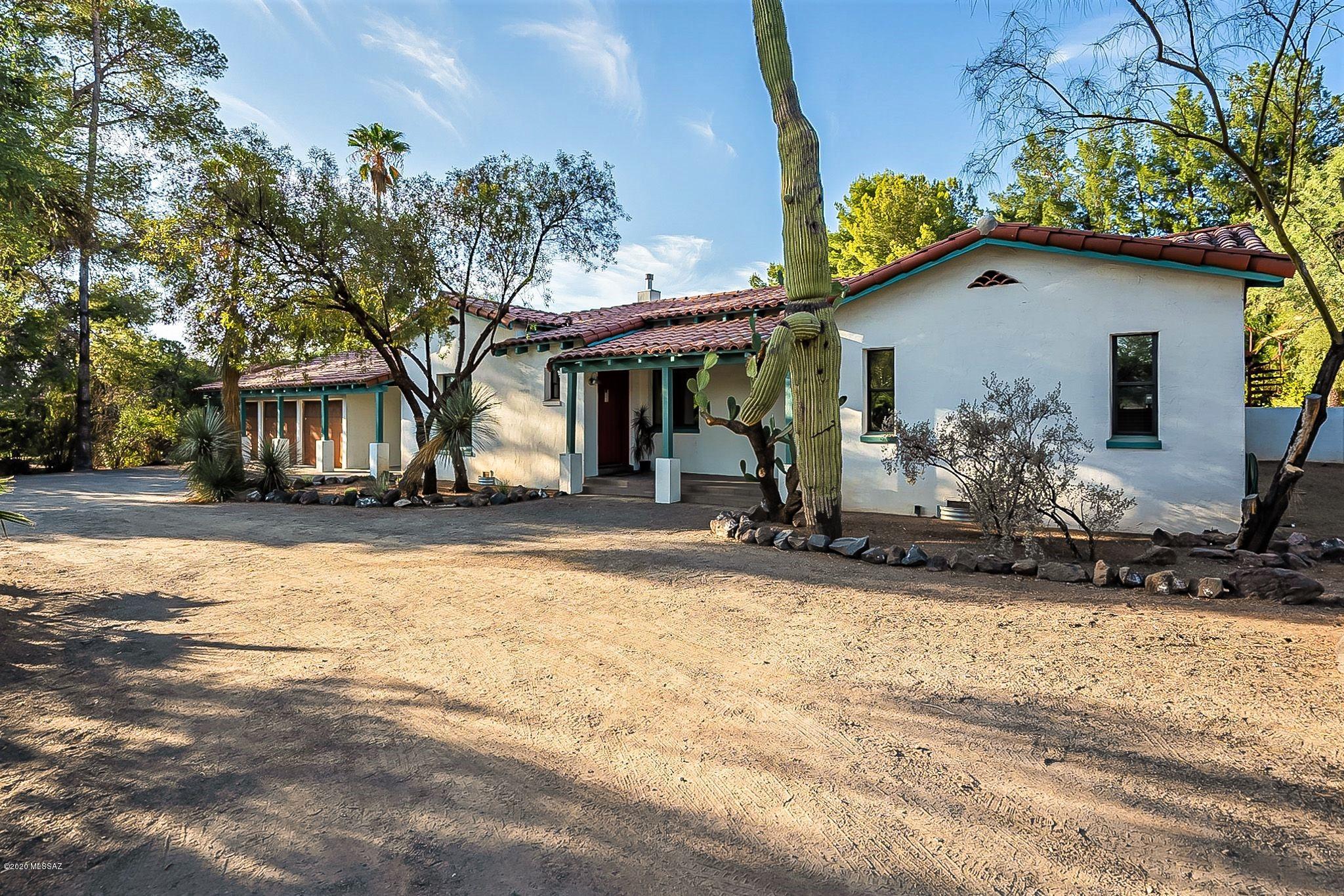 LOVELY SPANISH MISSION STYLE HOME IN HISTORIC EL ENCANTO ESTATES NEIGHBORHOOD. 3BR3BA Main House  w/ extra room for 4th BR, Den, Office or Exercise Room, Wood & Tile Floors, Stone Countertops, Dual Pane windows, Two-sided Fireplace & Huge Master Bedroom w/ large walk-in closet. 2BR1BA Guest House w/ Full Kitchen, Tile Floors, Stone Countertops & Dual Pane windows. Private Backyard w/ Gas BBQ, Pool & Cabana, Hot Tub, Workout Room, an abundance of trees, decorative fountain & a round lawn area. 3 Car garage w/ additional extra TALL carport, block privacy wall in front yard with drive thru and dual metal security gates. Great Midtown location. TO SEE VIRTUAL TOURS, CLICK ON THE ''PHOTOS'' TAB. TO SEE FLOOR PLAN, CLICK ON ''DOCUMENTS'' TAB.