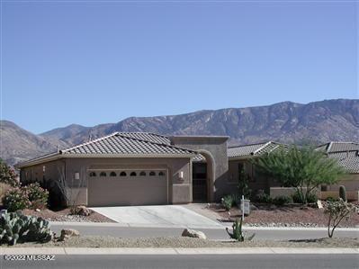 Spectacular Catalina Mountain & golf course views from this highly upgraded Cimarron model with casita. This home features a large open great room perfect for entertaining w/ a custom designed entertainment center, gas fireplace and room for large TV. Island kitchen w/ Bosch appliances, beautiful cabinetry, granite counters, pull outs and open to breakfast nook & great room. Master suite has mountain &  golf course views & easy access to patio. Upgraded en-suite with large shower, double vanities & enormous walk-in closet with built-ins. Den has a wall of stacked stone with large LED TV. Patio is an entertaining dream with custom waterfall &  pool, built-in gas BBQ and seating areas. Lovely gated courtyard. This home represents the finest in Saddlebrooke living!