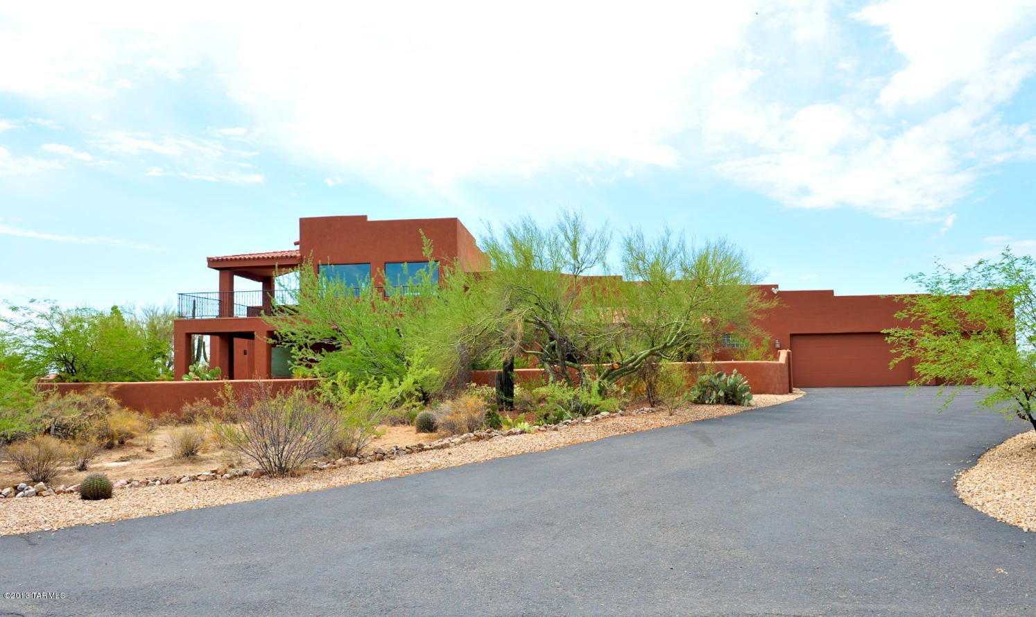 4.2 Acres of privacy with stunning mountain view. Built in 2004, Oversized bedrooms with walk-in closets. Storage galore. Decorator paint. Tiled floor inside and out. Great room concept with soaring ceilings. kitchen with SS appliances, granite countertops, a working island and walk in pantry. Large master suite with walk in closet, master bath with 2 vanities, walk in shower, and Jacuzzi tub for 2. Upstair mezzanine/library with wall to wall picture windows facing Saguaro Ranch and vista views .Built-in shelvings and cabinets in 4th bedroom/Den. Oversized 3+garage with extend length,insulated storage rooms, plus well lite workroom, all utilities rooms exterior to house. Outdoor kitchen/grill and island. 3 covered patios.Surround sound for great room and covered patios