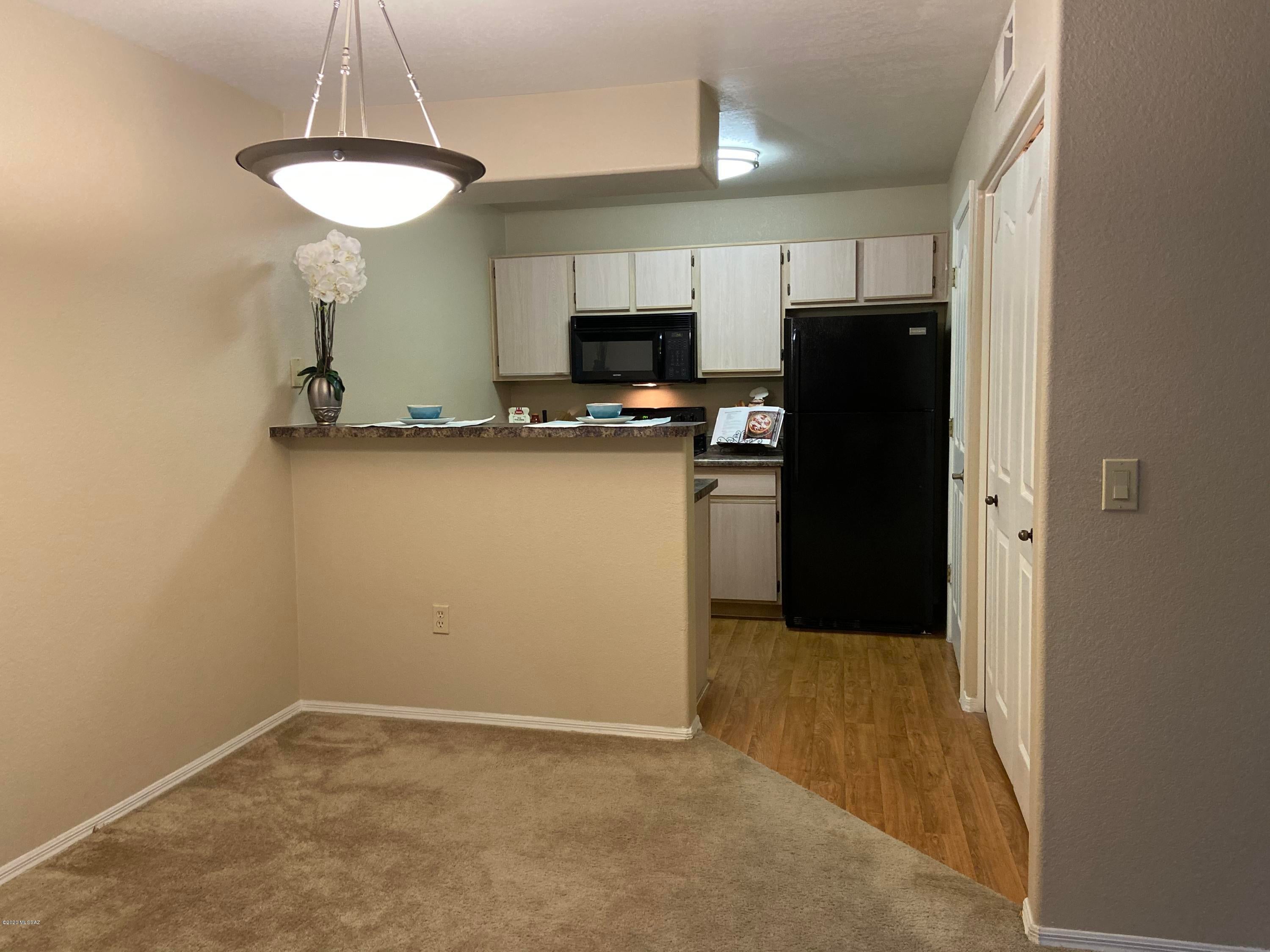 Cozy one bedroom location downstairs in Ventana Canyon area. Private patio that catches just enough of the morning sun to enjoy your morning coffee or tea. Your Kitchen features black appliances, oversize pantry and breakfast bar. Bright and open great room includes a ceiling fan and easy access to your patio. Oversized hall closet between the bedroom and bathroom, Bedroom features spacious walk in closet with full length mirrored door and ceiling fan. Conveniently located to the fitness center,one of two pools with water features and spas, as well as Ramada's with natural gas BBQ grills. Within walking distance to shopping, dining and natural walking trails. Golf and Hiking close by. Gated Access. Awesome Landscaping.