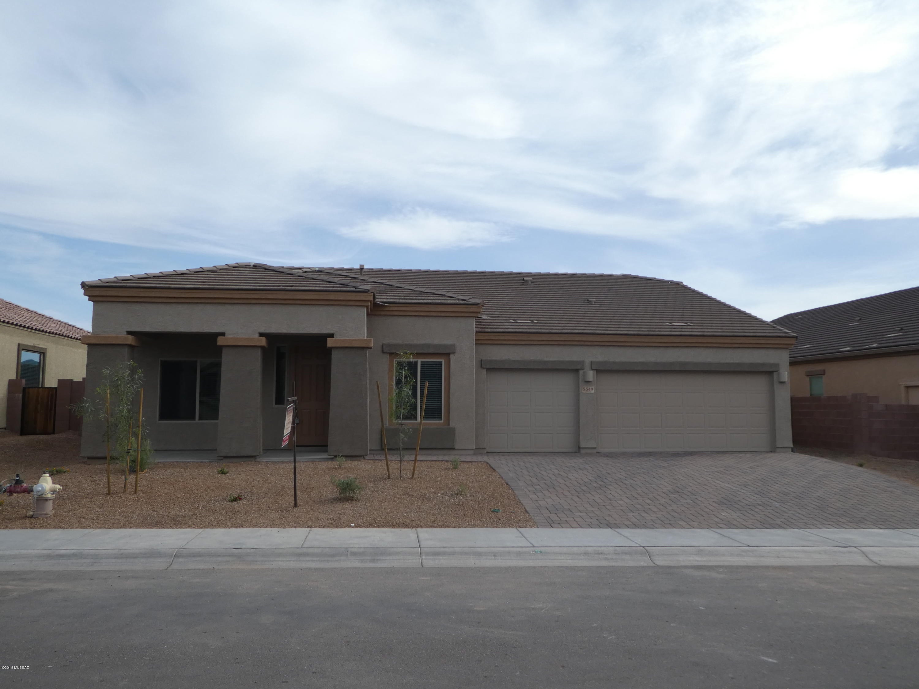 Minutes from Oro Valley, Northwest Tucson - Sterling Meadow Community - Newly built DR Horton (never lived in) Sabino Plan - 2688 sq.ft. split bedroom plan, 3 Bedroom, with den (could be used as 4th bedroom), 2 bath, , great room and family room, luxury kitchen with granite counter tops, all stainless steel appliances, gas cooking, double oven, osmosis system, dining areas, vaulted ceilings, tile and carpet, laundry room w/new washer/dryer, tank-less water heater, 3 car garage. All vegetation on drip irrigation system Pets considered. Easy access to I/10, schools, shopping, golf, medical and more. 15 miles to downtown Tucson. Move in ready.