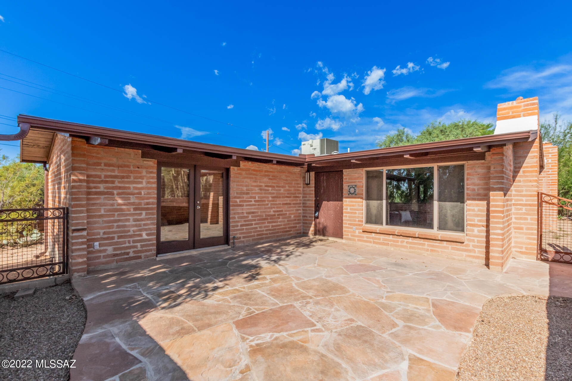 Text for a walkthrough video/more info. Nestled on a .6ac lot + surrounded in Mature Desert Landscape, this enchanting Casas Adobes Home is 3 Bedrooms/3 Bathrooms and 1979sf. With extensive updates; Ceramic Tile Floors; Tankless Water Heater; Granite Counters, Stainless Appliances + Gas Range in a Chef's Kitchen; Master BR Suite w/ partial Mountain View, Private Bathroom, + Sitting Area; Guest Ensuite BR w/ Private Bathroom; Living Room + Family Room each with fireplaces; plus the Architectural Details of a Premium 1950's Desert Home w/ exposed beams, custom wood interior doors, + custom tiled showers. Central A/C + Rainwater harvest cistern. 1yr minimum Lease, $50/adult Application Fee, $2350 Security Deposit, $150/pet Pet Fee with approved pet, $400 cleaning fee. Tenant pays electric, nat gas, water/sewer/trash.