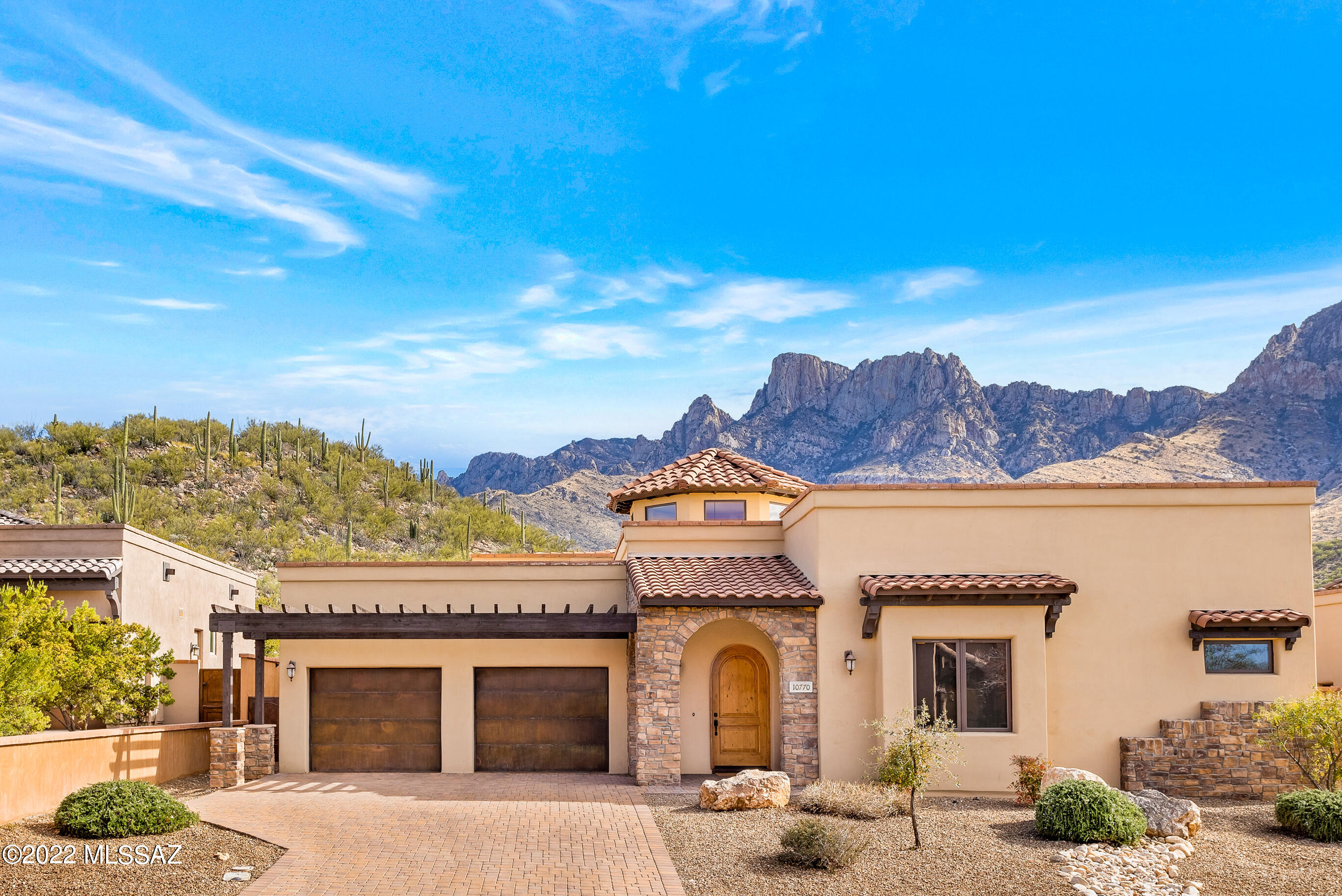 Spectacular Mountain Views from this Gorgeous Home in the Upscale, Guard Gated Ponticello Community in La Reserve. IMPROVED PRICE, MOTIVATED SELLER. Welcoming Curb Appeal w/Cobblestone Drive, Mediterranean Inspired Architecture, Stacked Stone Accents & Private Cul-De-Sac Street of Only Eight Homes. East Facing Pusch Ridge Mountain Views from the Spacious Great Room. Steel Frame Construction, Gas Burning Fireplace, Dramatic 20ft Coffered Ceilings, Beautiful Rotunda, Knotty Alder Doors & Trim, Pella Windows & Lovely Ceramic Tile Throughout. The Gourmet Kitchen Features Stainless Steel Appliances, Granite Countertops w/ Backsplash, Maple Cabinetry, Gas Cooktop, Beautiful Island & Walk-In Pantry. (Per La Reserve CC&R's - No Rentals Less Than 6-Months Allowed. Thank you!) Spacious Owner's Suite w/ Custom Tiled Shower, Two Executive Height Vanities w/ Vessel Sinks, Walk-In Closet & Gorgeous Views from the Bathtub. Large, Private Backyard w/ Multiple Covered Patios & Wrought Iron Gates. Stunning, Unobstructed Mountain Views. Ample Storage Throughout Home & 3-Car Tandem Garage. This Truly Special Home Can Be Yours Today!