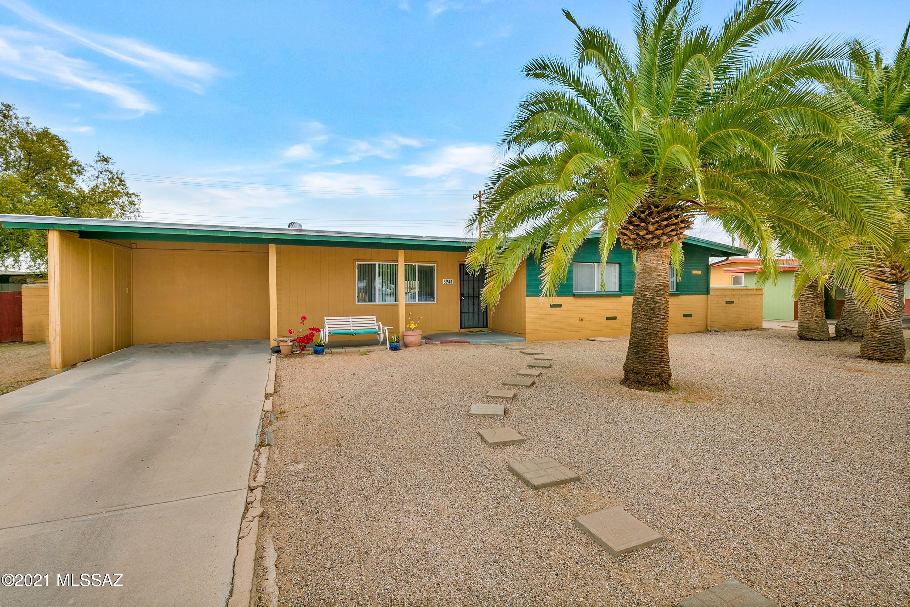 Welcome home! This charming home greets you with immaculate desert landscaping with beautiful palm trees! Inside, the gorgeous interior showcases a very well maintained 3 bedroom, 2 bathroom floorplan with a large 4th room that could be a 4th bedroom, den or office. Throughout the home, there is neutral paint, ceramic tile and updated kitchen, bath and countertops. Your beautiful kitchen showcases ample cabinet space, matching white appliances and a gorgeous tile backsplash. This home has been meticulously and routinely updated over the years. Additional features are the new A/C and water heater replaced within the last 3 years. Outside, you have a huge yard with a covered patio and extended patio with pavers. The blank canvas is waiting for you to design your personal desert oasis! Don't miss out on this stunning family home! Call to schedule your showing today!
