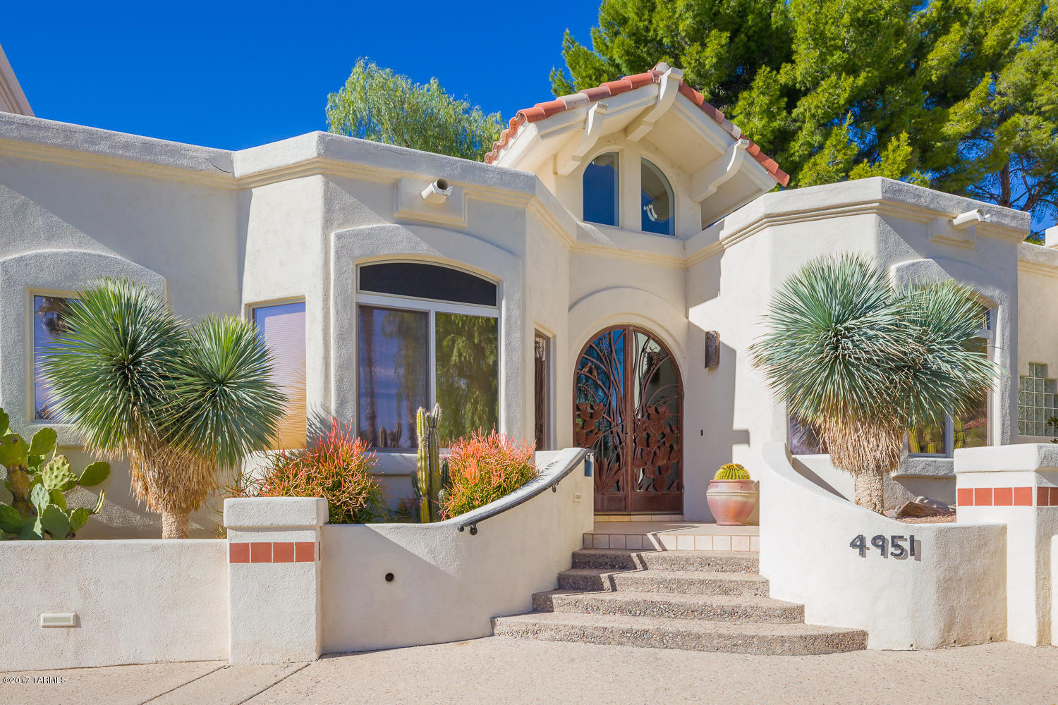 Stunning Santa Barbara style El Diamonte Townhouse on the 8th fairway of prestigious gated Skyline Country Club. This home is located on one of Tucsons most beautiful streets!(Calle Brillante). This magnificaent home features dramatic high ceilings, light & bright open floor plan with large windows overlooking the beautiful Skyline golf course and you can't miss the awesome views of the Catalina mountains. An exceptional spacious master bedroom with its own reading room and large master bathroom.  You fall in love with the kitchen from a multitude of cabinetry and the openness with its own breakfast nook in the corner. Skyline CC community homeowners amenities include use of the country club exercise facilities and limited use of other Club amenities.  Enjoy Tucson living at it's best!