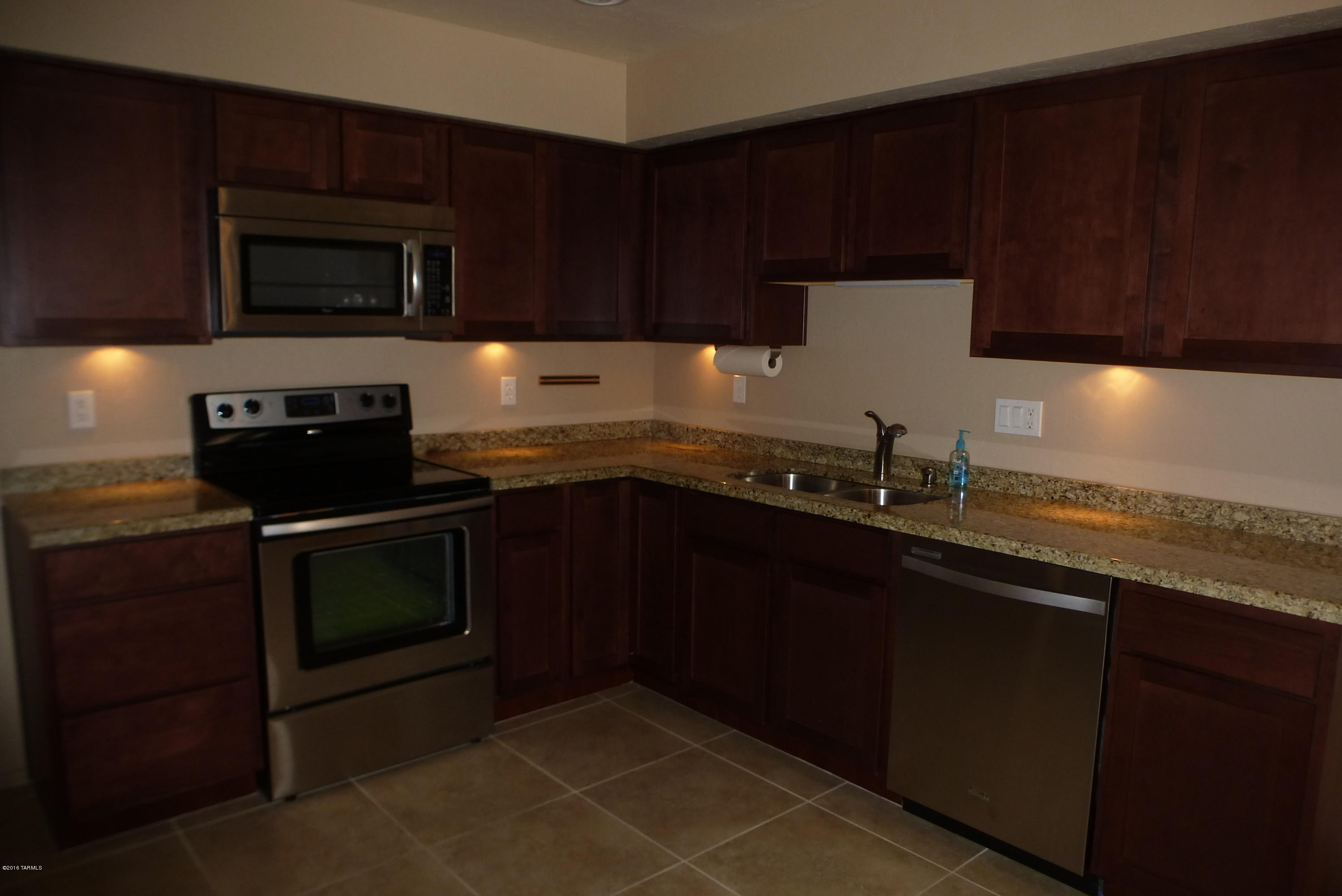 This beautiful 2 bedroom, 2 full bath remodeled home has a large eat in kitchen with all new cabinets and stainless steel appliances, granite counters in kitchen and bathrooms. Family room has a fireplace and new upgraded lighting. Large covered patio in the large back yard with nice mountain views. New roof, heat pump, AC and newer evaporative  cooler. The community has a pool, spa, tennis court and a park-like setting. This house is move-in ready and won't last long!
