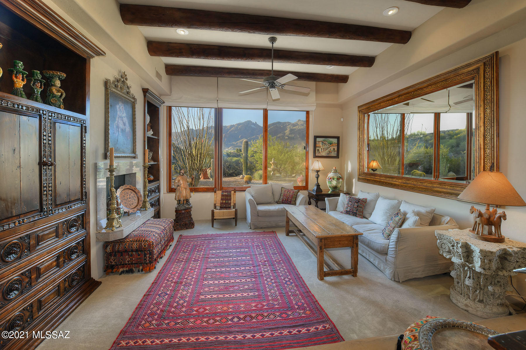 Sellers will accept or counter offers between $950,000 and $1,025,000.  This stunning, remodeled & updated Southwestern-style home is nestled in prestigious, guard-gated Catalina Foothills Estates #10. The 2,405 sq. ft. residence is high on a hill on a glorious 3.56-acre cul-de-sac lot, and features sweeping, unobstructed Catalina & Rincon Mountains, Pontatoc Canyon and Tucson city views!  Highlights include a long & winding driveway, a concrete overlay walkway, oxidized wrought iron & exquisite arched wooden front entry door, an open and flowing floor plan, scored & polished concrete flooring, historic carved wood accents, custom solid mesquite and alder hardwood doors throughout, wood casement windows, sliding doors, Roman shades on all windows, and Tucson rolling shutters on all windows & doors.  The spacious great room features a high ceiling, a dining area and art niches.  The comfortable family room offers a viga beamed ceiling, a fireplace with imported marble surrounds, and a wall of glass framing mountain vistas. The fabulous gourmet kitchen provides custom-built cabinetry, a professional grade stainless steel gas stove & hood, marble counterstops, two walk-in pantries, and a reverse osmosis water system.  The entire home comes with a water filtration system & a water softener.  Both bathrooms have been remodeled and offer imported and one-of-a-kind vanities & sinks, and a hand-tooled copper bathtub in the master bath.  Enjoy the beautiful outdoor living areas including an expansive covered porch, a second covered patio, extensive natural landscaping, a water reclamation system, privacy and panoramic views.  District 16 Schools.