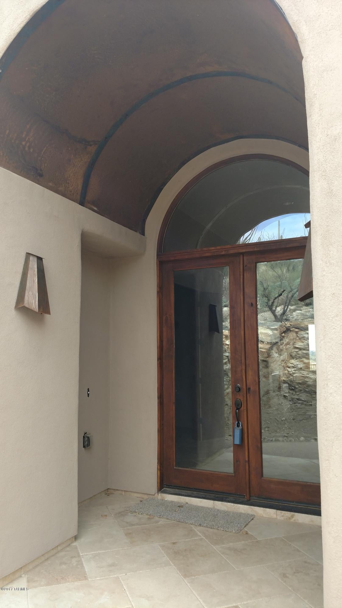 Gorgeous brand new home with amazing views.  Travertine tile throughout with new carpet in bedrooms.  Gourmet kitchen with large island with seating, perfect for entertaining. Also for entertaining is a 7 seat Theater room.  This home is a must see.