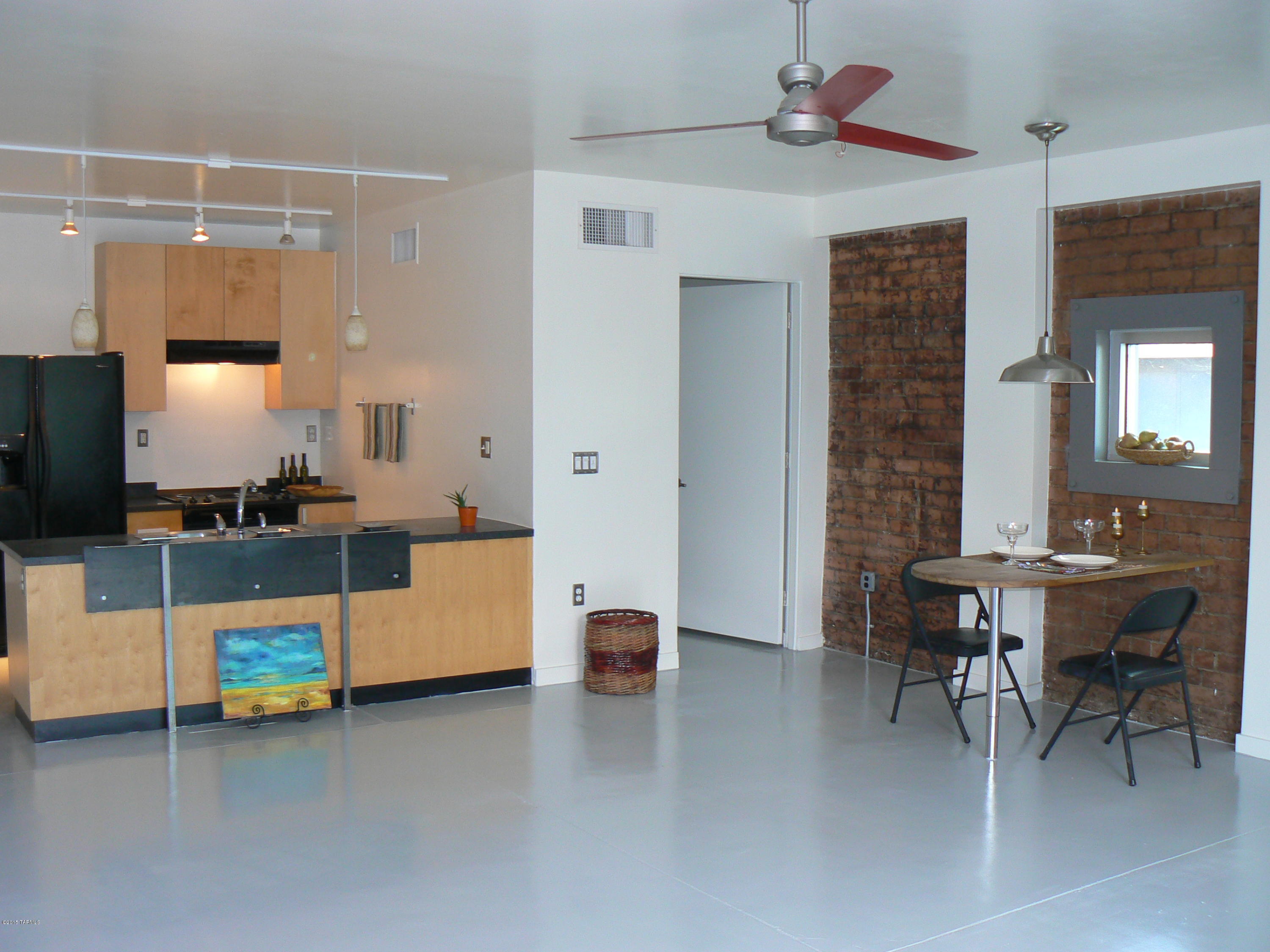 Contemporary living in an urban industrial modern architectural setting is for you; then this could be your next home.  Exposed brick walls, thick steel framing around the windows and concrete floors all tie together to create the modern look with all the amenities.  This is a first floor end unit (A style),larger size studio in the Ice House Lofts.  Move in ready, just repainted all the walls and refinished the floors.  The security gates offers privacy and peace of mind, so all you have to do is enjoy the setting.  The grounds of the property offers a pool, spa, gym, storage facilities (24 sqft. appx) and covered parking set in recycled theme of weathered piping and motor sculptures.  The HOA fee is based on the size of the unit and covers water, sewer, trash and exterior maintenance