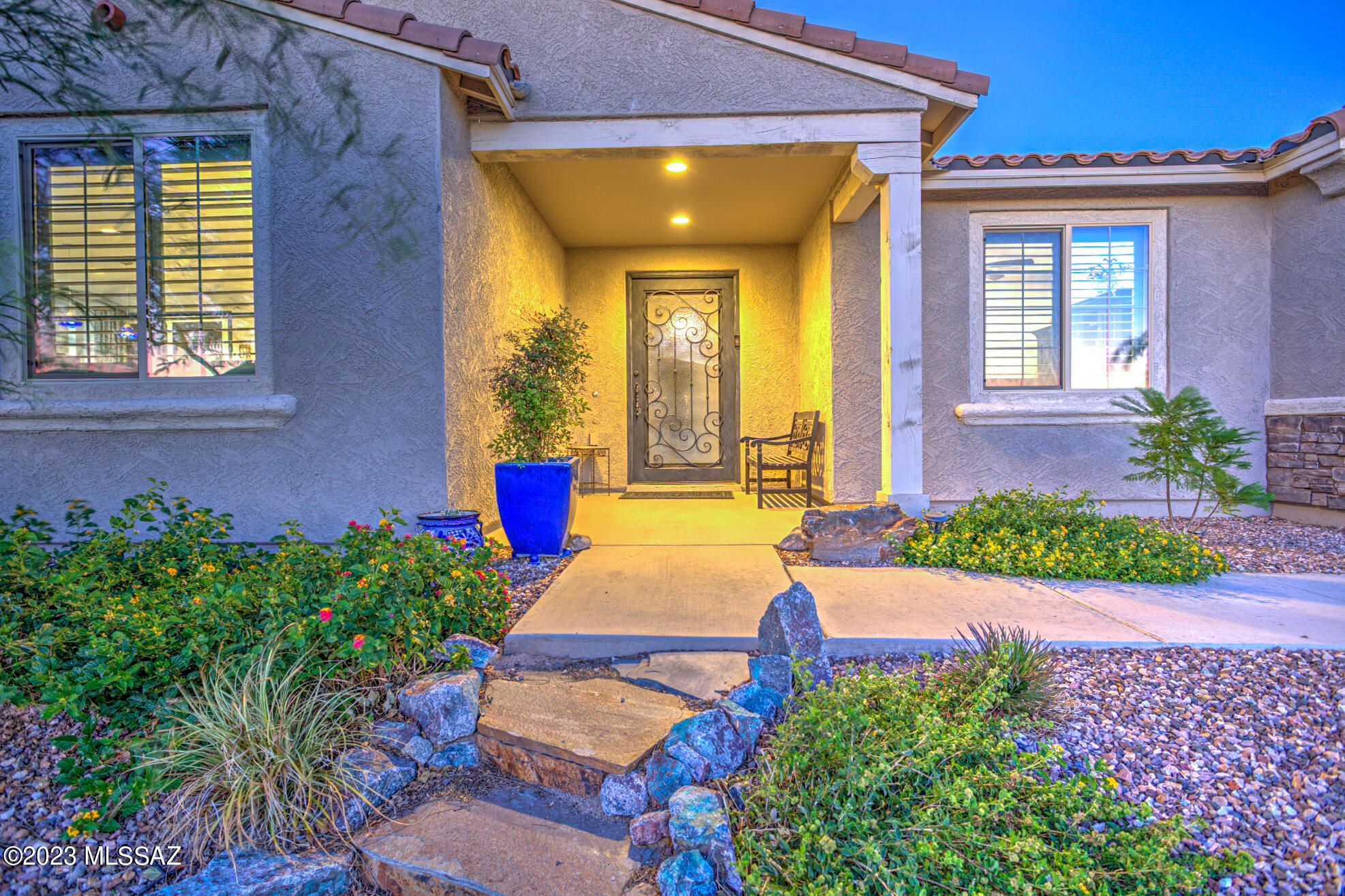 Seller offers Buyer rate buy down concession of $10,000.  Absolutely exceptional home located in Saguaro Trails!   Highly upgraded with the builder to begin with, then continually improved since then!  Enter through the gorgeous custom iron front door into the Foyer with imported inlay tile accent.  Great Room open concept living with 9' ceilings gives an open feel and easy, flexible space to live in.  Gourmet kitchen features huge island, upscale stainless steel appliance package, under counter lighting and top tier slab granite selection.  Split bedroom floorplan, 8' interior door package, upgraded stone look tile flooring throughout,  whole house air and water filtration systems in place, and highly efficient with OWNED SOLAR.  Primary suite features access to Screened In Covered Patio, spa-like ensuite bath and oversized walk in closet, double vanity and separate make up vanity area, plus a huge shower with seat and niche. Plantation shutters and custom draperies throughout. FABULOUS backyard makes great year round outdoor living with screened in patio, nice privacy with raised wall, amazing pebbletec SWIMMING POOL, salt water system, upgraded mechanicals, travertine paver decks and coping and a gorgeous ONYX fountain. Mature landscape, meticulously kept including grassy turf, trees and seating area, upgraded irrigation system and lovely healthy plantings in front and back, all done with the most discerning taste that will WOW you! Vail School District. Community features a park/pool and clubhouse area with ball courts and several other pocket parks throughout. Easy access to cycling loop and Fantasy Park trails. Minutes to Saguaro Park East and numerous hiking and walking trails. When you want a move-in ready that is fully ready to enjoy... this is it!