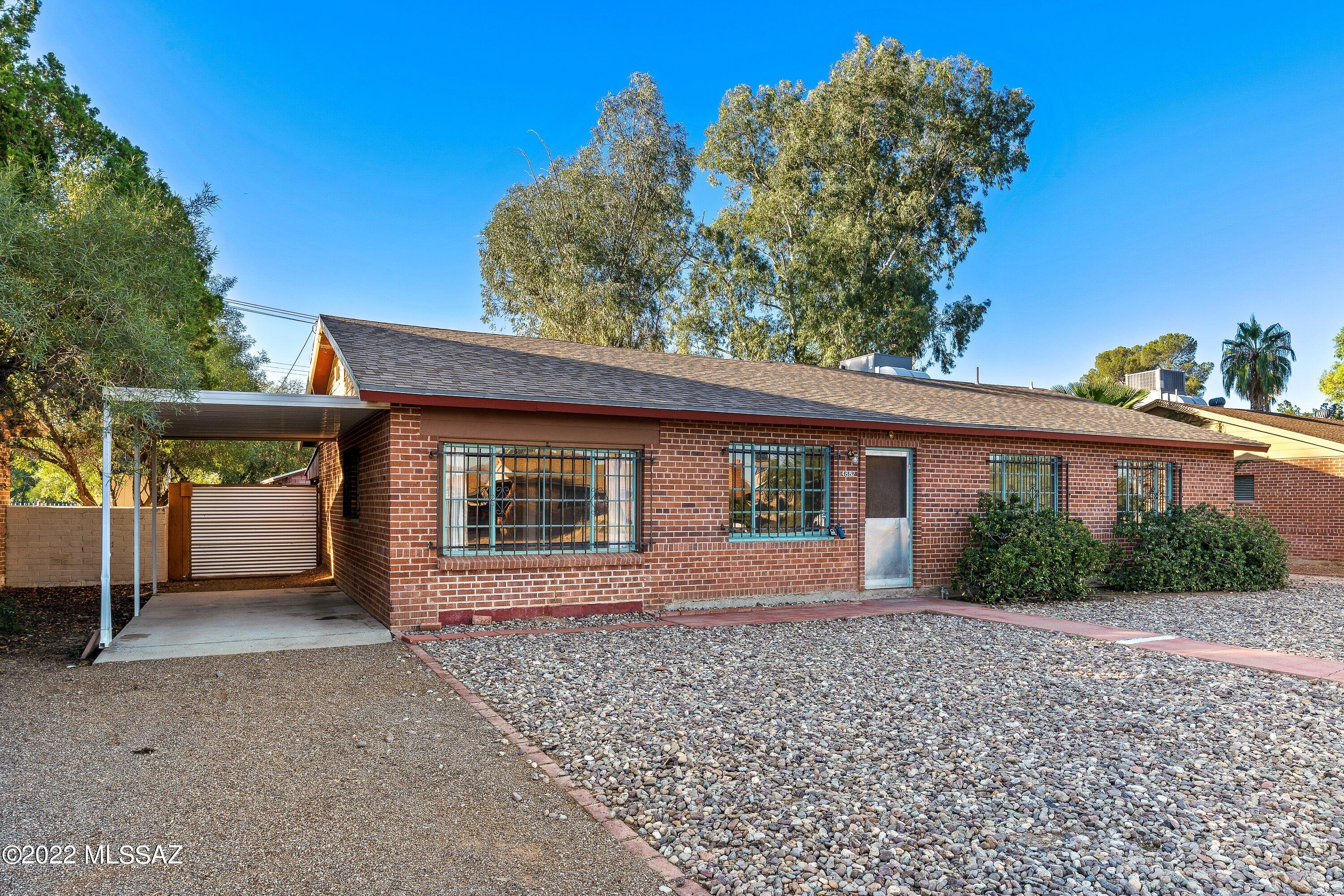 Range Priced: Seller will accept or counter offers w/in range price between $298,900-$315,000 to take into consideration seller concessions. 4 Bed, 2 Bath ideal centrally located home. Stained concreate floors. Laundry room & bonus room that could be used for home office or a 4th bedroom. Large living room & separate family room. Huge back yard that backs up to Hoffman Park. Front faces north with awesome mountain view of the Catalinas. Plenty of room to park an RV or toy haulers. Or add an Accessory Dwelling Unit (ADU) for guest quarters. Rear access to home that has an additional covered carport & storage shed. Large back porch that looks out towards the park. Great family home or perfect for an investment home or an Airbnb. owner/agent