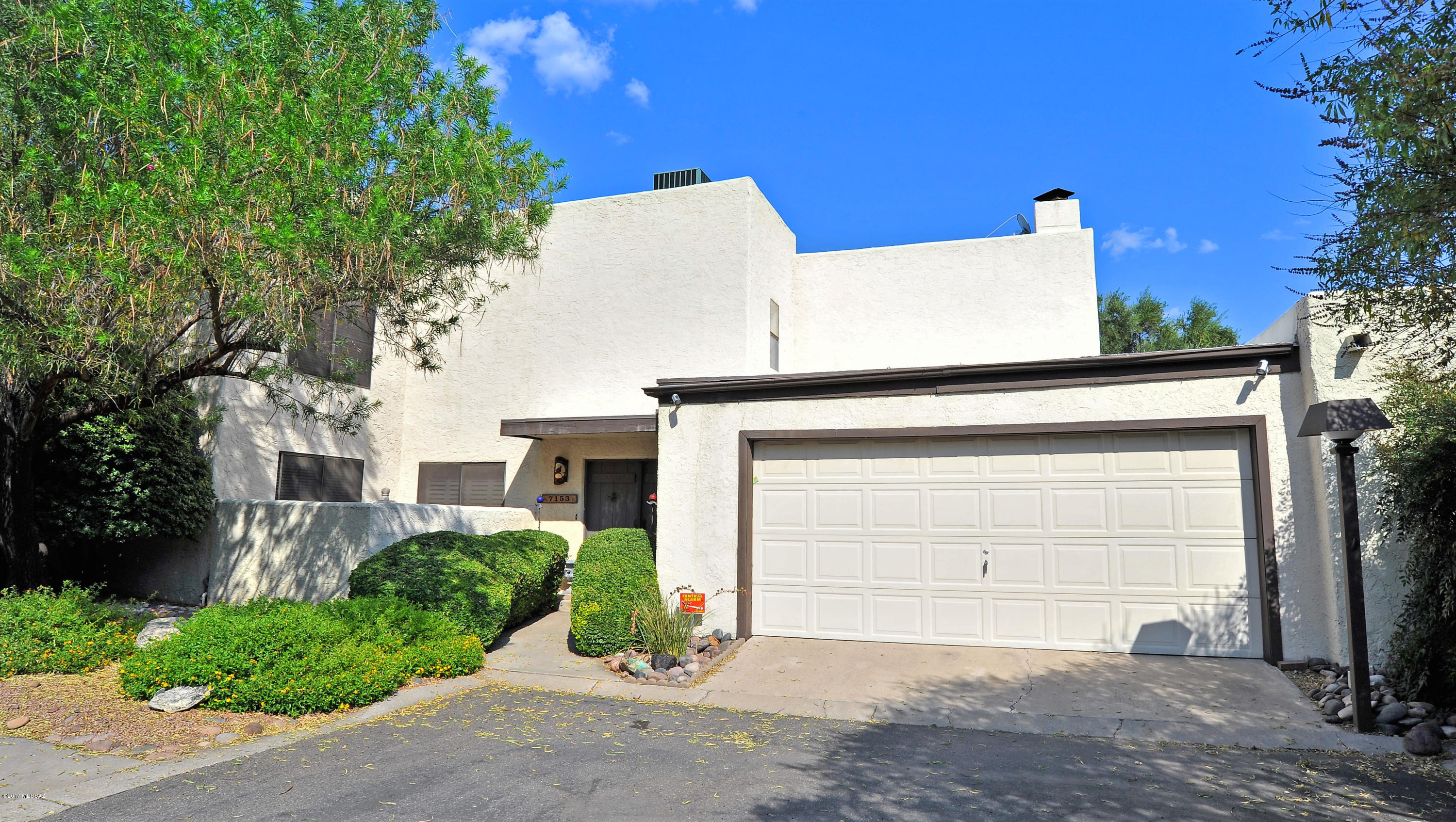 Range priced $325,000-$359,000. Amazing custom home remodeled and redesigned by local Tucson movie producer. Bask in the ambiance of the Southwest and enjoy the living space that lends itself to entertainment. This home features soaring alder wood beam ceiling and doors with black iron accents and a custom Mexican cantina, Saltillo floors, beehive fireplace, 3-4 bedrooms or office plus a loft. Gorgeous upstairs master suite and in home PebbleTec spa. The community features 2 pools, spas and tennis.