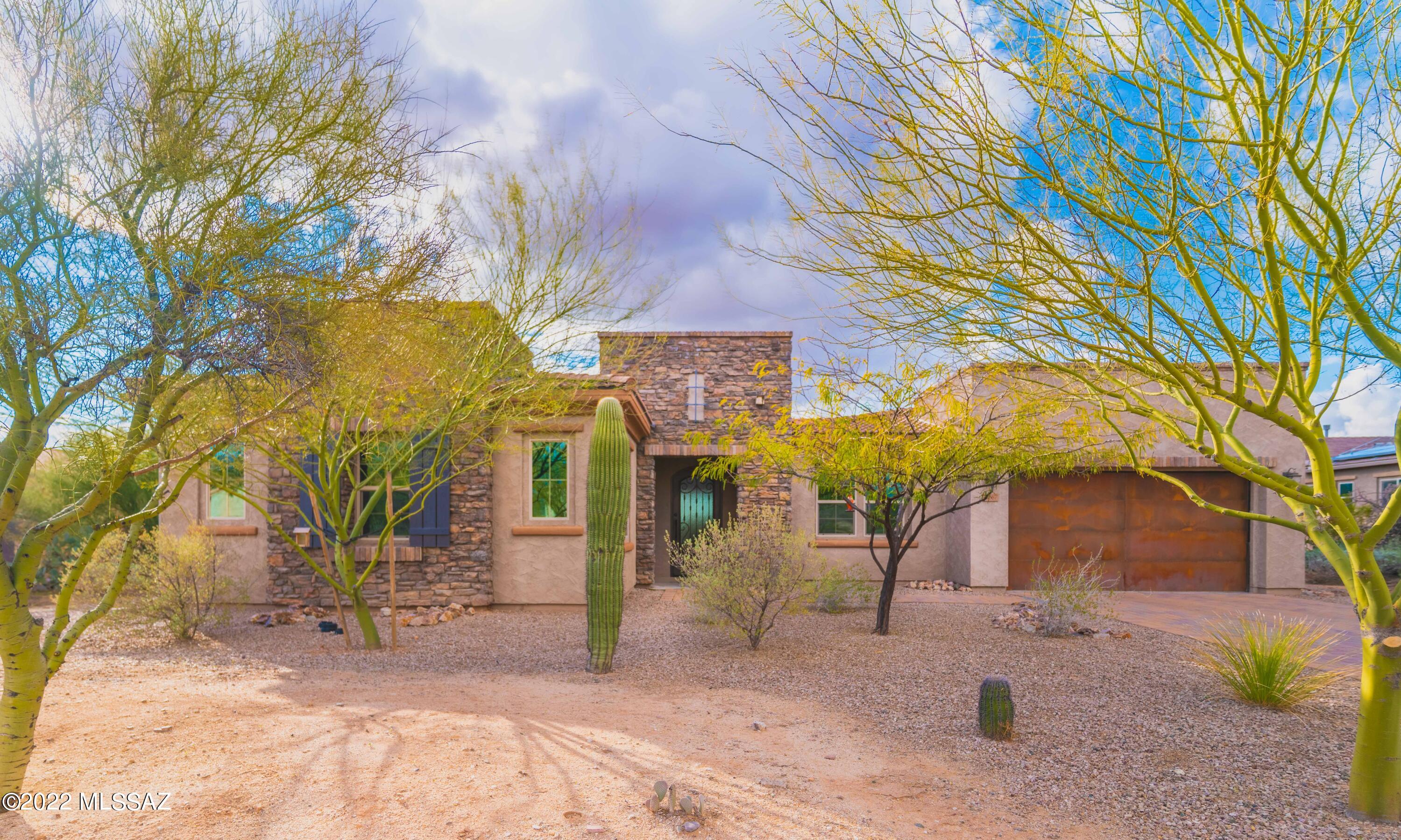 Beautiful single story home in an exclusive gated community. This 5 bedroom 3.5 bath home is the pride of ownership. From the time you walk up to the time you leave, you'll see all the generous upgrades. From the paved driveway, rustic copper garage and oversized iron front door to the gourmet kitchen (with stainless steel appliances, gas range, GE profile double ovens, huge espresso granite sink, and walk-in pantry). You'll fall in love with the huge master suite with his and her vanities and closets. Cozy family room with floor to ceiling stone fireplace. The kids wing has a Jack and Jill setup and the guest bedroom also has it's own bathroom. Exercise room and office make this home complete. Backyard is spacious with mature fruit trees, artificial grass, ramada, and gorgeous scenic view