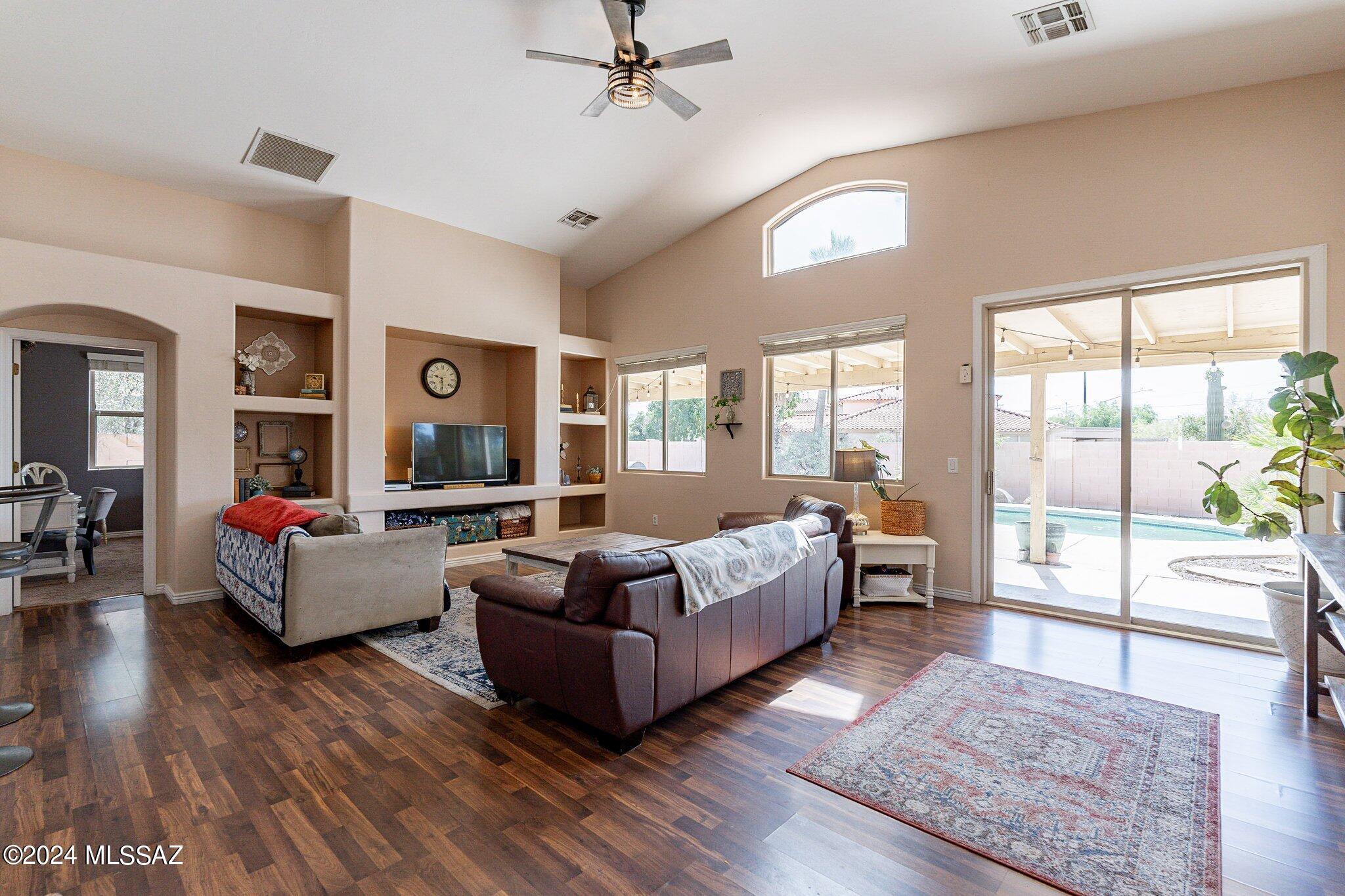 Live life to the fullest in this convenient and friendly location!

Situated in a desirable subdivision close to I-10, this home offers the perfect blend of easy access and peaceful living. Enjoy a variety of restaurants and the Tangerine Outlet Mall just minutes away.

Relax and unwind in the sparkling pool or host unforgettable gatherings on the covered patio, perfect for evening BBQs.

This well-designed split floor plan offers privacy and comfort. High vaulted ceilings create an airy feel, while the expansive master suite provides a tranquil retreat. The master bath features dual sinks, a large garden tub, and a walk-in shower for ultimate convenience.

Welcome to a place you can call home!