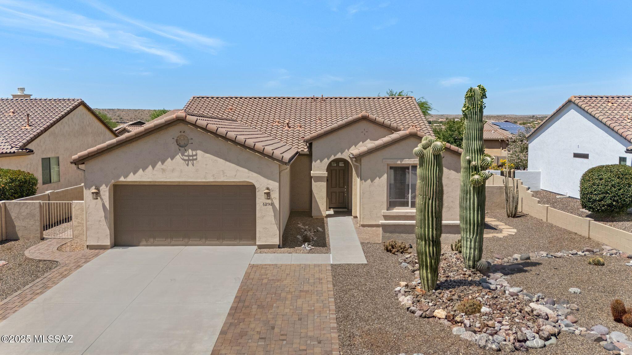 2012 Dolce with front Mountain Views.  Pavers on both sides of extra wide driveway. Paver Courtyard with Mountain Views! Foyer leads to spacious Great Room & Open Concept Living. Kitchen offers Cabinets with slide outs, Granite Counters, Glass Tile Backsplash & Slate Appliances. Nice Dining Area with extended Bay Window & Slider to Patio.   Large Owner's Suite. Owner's Bathroom with Walk-in Shower with bench & Walk-in Closet. Den/Office & Powder Room. Guest Bedroom with Closet offers Ensuite Bathroom with Tub/Shower. Laundry Room with W/D, Cabinets & Counter Space. Extended 25 ft. 2 Car Garage with no step. Enjoy the Covered Patio with a large extended Paver Patio for more entertaining space. Spacious gated yard to enjoy & create your own Oasis! Just the place to call home!