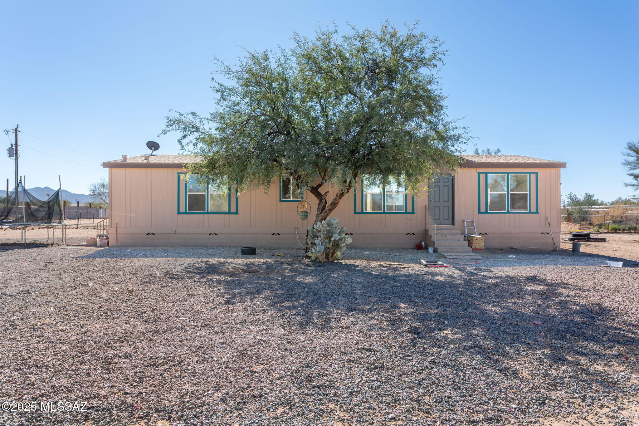 Welcome to this inviting 3 bedroom, 2 bathroom manufactured home located on 1 acre in Picture Rocks area.  This home perfecting blends comfort and functionality.  Step inside to discover a light-filled great room - the heart of the home - designed for both relaxing and entertaining.  The open floor plan flows seamlessly from the spacious living area to the kitchen and dining space.  Split-bedroom layout adds privacy and the primary suite offers a private retreat with its own bathroom, while two additional bedrooms provide flexibility for family, guests, or a home office.  Plenty of room for an RV, garage, carport, or horse. Property also has second electrical and sewer hook-ups
