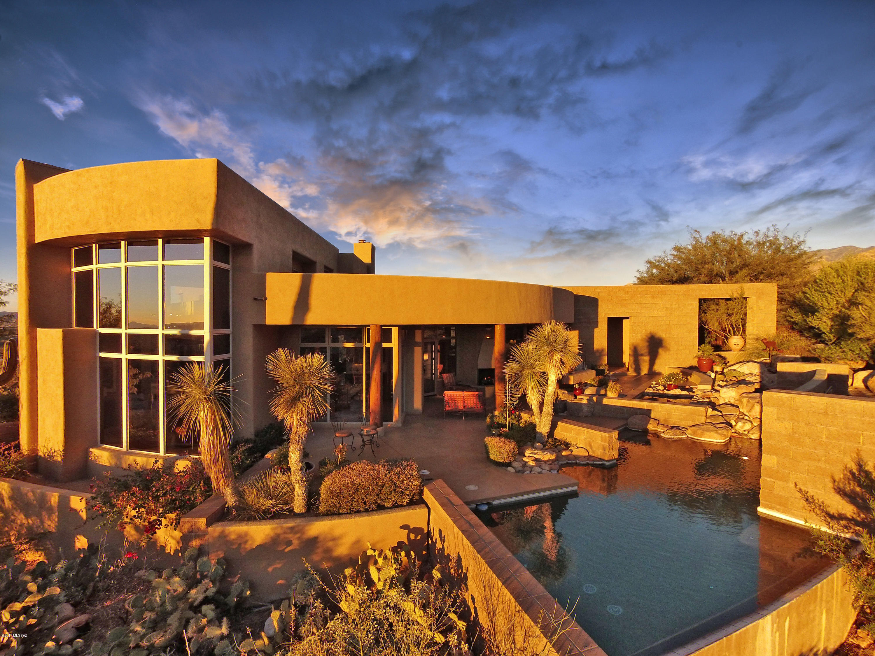 You will be WOWED, by the Captivating & unobstructed, panoramic mountain views,from this hilltop retreat! Located in the guard-gated La Reserve.This Kevin Howard design is perched on 2.16 acres of Privacy and is  surrounded by Tucson's natural desert beauty & adjacent to open preserve.  
Home hosts; 20'wall of windows in great room & formal dining area.3BR,5BA+office,den,& Az room. 4 fireplaces through-out
Kitchen offers; granite & tile counters,sit up bar,sub-zero fridge,dacor oven,wine fridge & ice maker.Large master retreat w/separate
sitting area/office.Outdoor living features;Heated Pool/spa/relaxing water feature,outdoor kitchen and many areas to enjoy the views. Stunning Views from every window!