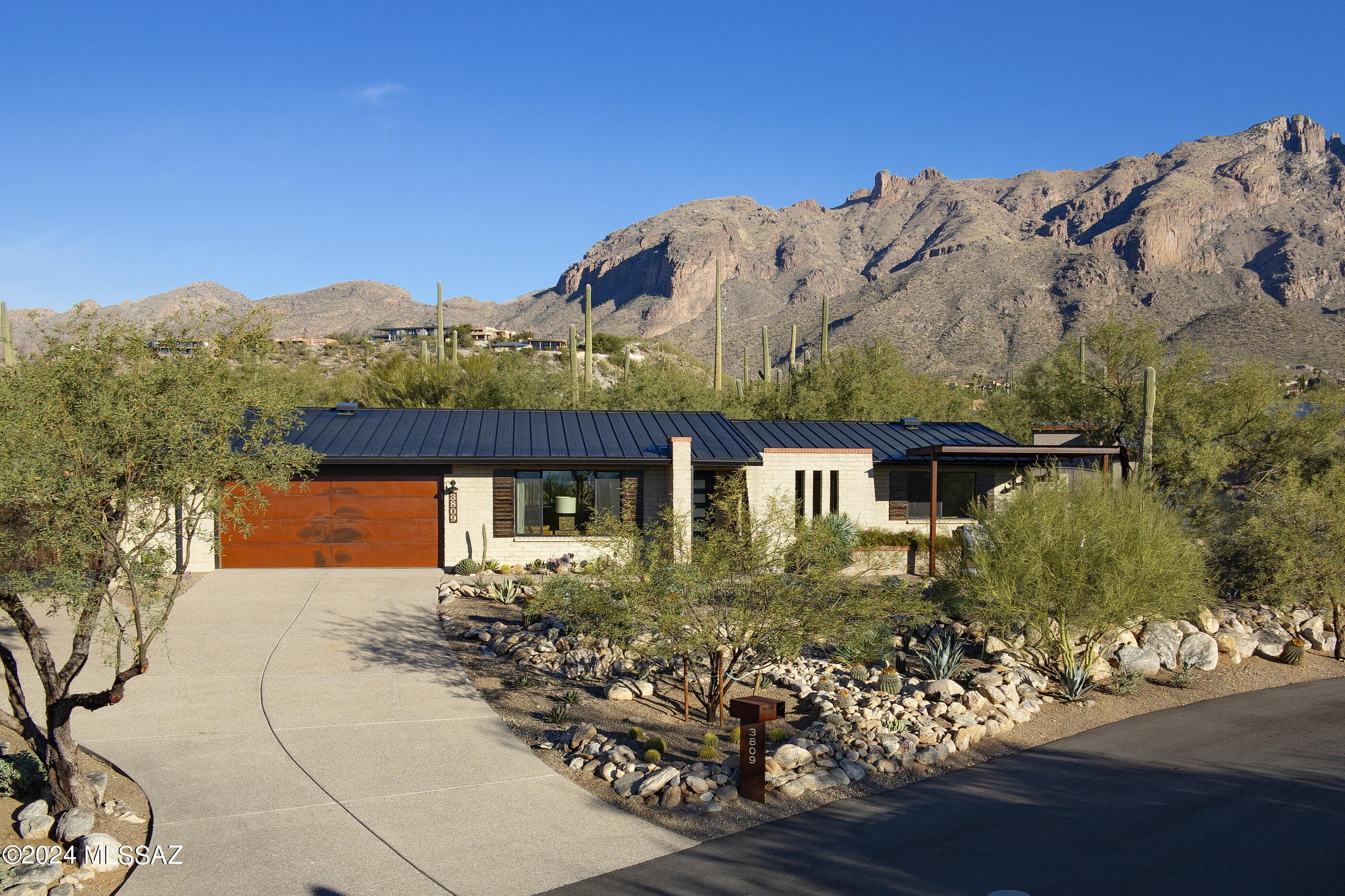 A fresh, modern classic in the Foothills. Home was completely remodeled by respected local builder in 2020. On an elevated lot, situated for maximum privacy, city views from front and mountains to rear. Landscaping is native and well-maintained. Rebuild took the house down to foundation, with emphasis on creating a sense of spaciousness and light. New plumbing, electric, HVAC, doors, windows and roof. Floor is concrete overlay throughout. Master suite is stunning. Separated guest room. Existing office could convert to a fourth bedroom w/addition of a closet. All energy-efficient appliances and excellent insulation for low utility costs. Western side yard has mature citrus and gardening boxes with timer-irrigation installed. New cedar hot tub in rear. All energy-efficient appliances and excellent insulation for low utility costs. Western side yard has mature citrus and gardening boxes with timer-irrigation installed. Rear yard terraced and planted, with new cedar soaking tub in place. A beautiful modern oasis in the desert.This home stands out as one of my all-time favorites! How often do you find a "smaller home" taken down to the studs and totally rebuilt in a well-established neighborhood, with amazing views? Professionally designed & decorated. No detail went untouched. Home was expanded with new foundation in the rear to allow for large master suite looking up to the Catalina Mountains. Windows are HUGE to allow all the Arizona light in. One bedroom is separated from the main living areas, making it ideal for guest quarters or a mother-in-law suite. Mature saguaros and mesquites fill the backyard, and a new cedar hot tub has been added to spend clear nights gazing up at the stars. Water system by LifeSource, for whole house water softening and purification. Truly one of a kind. Please read disclosures attached to listing as the owner has gone into great detail on the remodel.  Current owners never anticipated moving, but family has spread out and they want to be closer than Tucson. Truly drop dead gorgeous!