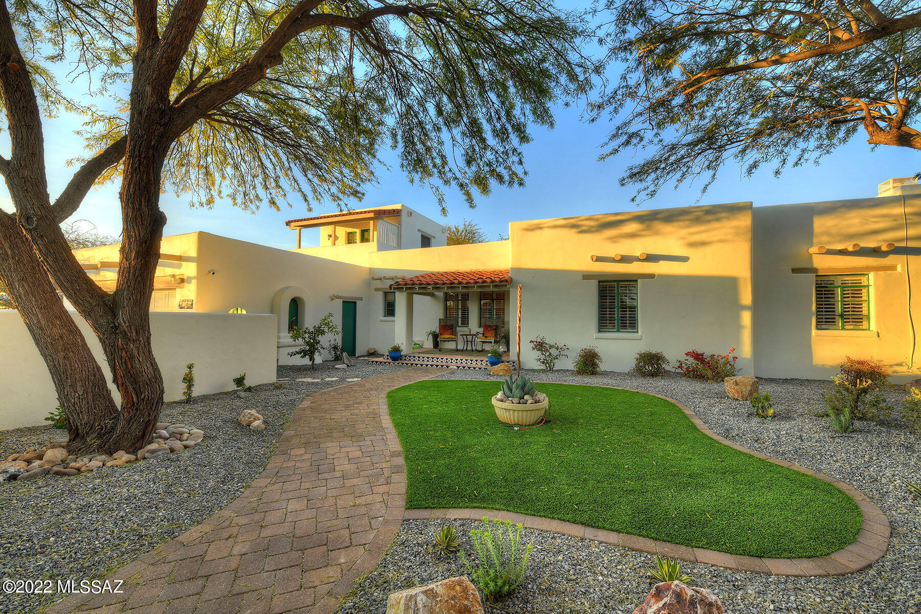 Absolutely charming Hacienda style home close to UofA, downtown, Banner Medical Center & AZ Inn.  Enjoy convenient urban living in the 4BR & 3BA house w/separate 1BR/1BA casita.   Updated kitchen w/granite counters, huge island, extra tall cabinets, & beautiful 8' double sliding doors to patio melds old world charm and the best of today's life style.  Beamed ceilings, hardwood floors, 2 cozy fireplaces, dual master suites, spacious great room, dining room are just a few of the features of this property.  The casita and opportunity for an additional casita is great for rental income.   See this today - it won't last long!