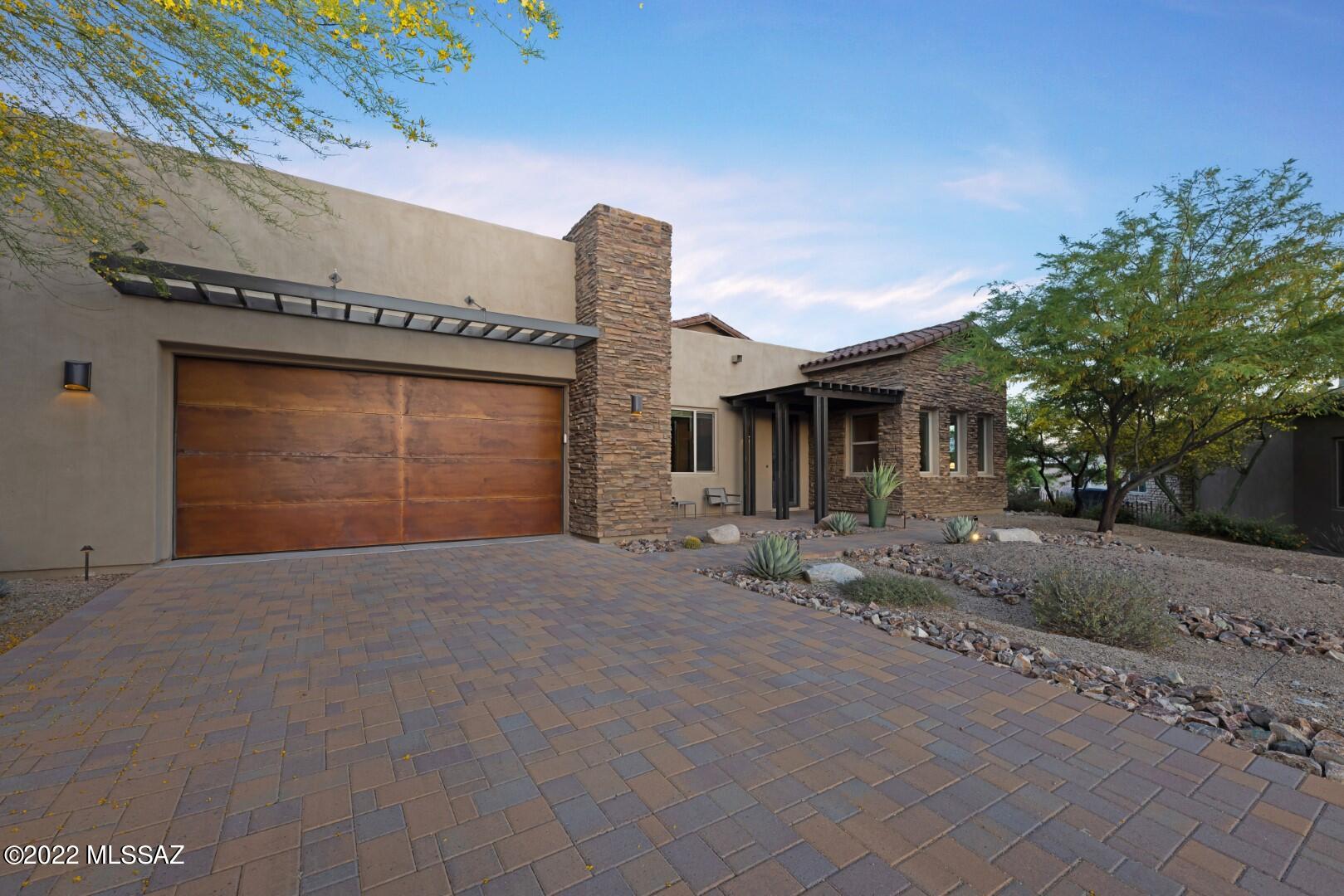 Premier location in the Enclave at Stone Canyon within walking distance of the Stone Canyon Health and Fitness Center, Golf Course, and Clubhouse. Shows like a model with views as good as they get! Large rock formations, giant saguaros, and gorgeous Catalina Mountains. Gourmet kitchen boasts large island w/seating, Silestone countertops, designer cabinetry, SubZero and Wolf  appliances, and walk in pantry. Four bedrooms, 3.5 bathrooms, large Cul-de-sac lot, fire pit, hot tub, afternoon shade!   Easy to show! Call agent (and Stone Canyon resident) for appointment and tour of the Stone Canyon amenities.