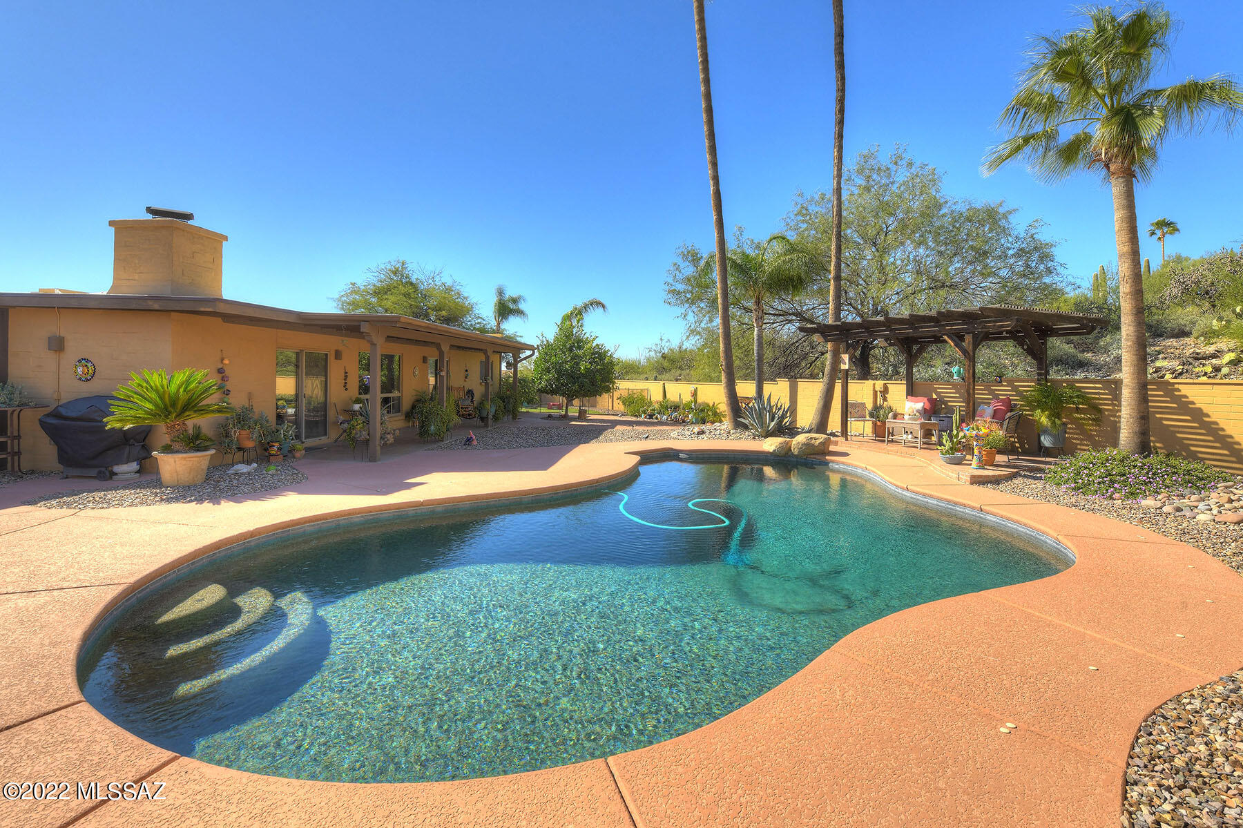 Resort style home perched on a private cul-de-sac with sweeping mountain & city views! Carefully maintained & recently updated. This large 4 bedroom+ home has many amenities to choose from! Guest quarters with private side entrance, large laundry room, finished garage, gas fireplace, wet bar off the kitchen and timeless Saltillo tile throughout the entire home.  The spacious backyard is truly your own private oasis with a solar heated swimming pool. Enjoy the hot tub, covered patio, private Arizona room, gazebo and a large gated turf area for kids to play.  Have peace of mind with a newly replaced roof.  Call today for your private showing-do not miss out on this turn-key property!