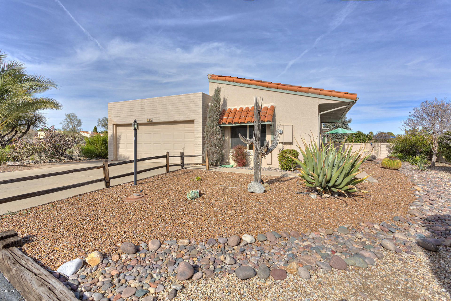 BEAUTIFUL CORNER LOCATION W/VIEWS IN DESERT HILLS 2, A SINGLE FAMILY RESIDENCE. ADDED SQUARE FEET W/ENCLOSED & MARVELOUS ARIZONA ROOM. GORGEOUS VIEWS OF SANTA RITA MTS INSIDE & OUT OF THE HOME. STEP INTO THE FOYER ROOM/ATRIUM FOR NATURAL LIGHT. KITCHEN W/STAINLESS FRIG, IN KITCHEN DINING AREA. ROOMY LAUNDRY AREA W/PANTRY & ALL APPLIANCES INCLUDED. UPGRADES TO THIS HOME  ADDED LOVINGLY BY SELLERS, NEWER PELLA WINDOWS, MASTER ENSUITE UPGRADES, NEWER ROOF COAT & NEWER HEAT PUMP 2019 & WATER SOFTENER. 2 CAR GARAGE HAS SPACIOUS STORAGE CLOSET. BACKYARD IS GATED, PRIVATE & BONUS SPACE FOR A DOG RUN. BEAUTIFUL FLAGSTONE PATIO/PAVER AREAS. PRIVATE AREA FOR MORNING COFFEE/COMMON AREA BORDERS ON WEST SIDE OF HOME. NO HOMES DIRECTLY BEHIND. DO NOT MISS AN OPPORTUNITY TO MOVE INTO THIS BEAUTIFUL HOME.