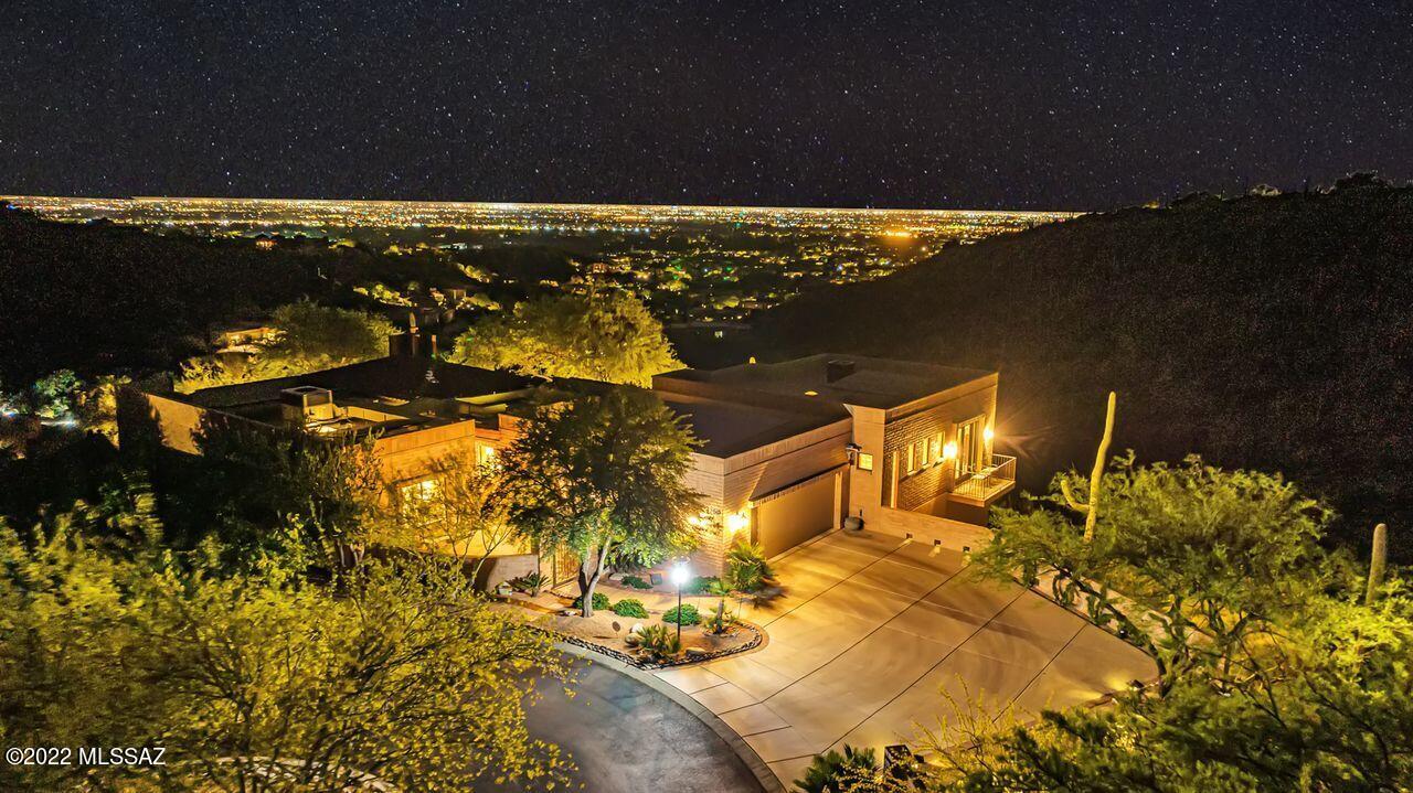 A life of leisure surrounded by the quiet privacy of the desert awaits the new owners of this elegant home which has evolved over the years. What started as a small home at the very end of a .63 cul-de-sac lot with spectacular city & mountain views, has emerged as a 3,299 square foot 3BR/3BA/Bonus Room luxurious dwelling. Everything you could possibly dream of has been done for your pleasure. The new master bedroom & bath which were added in 2006 were built out over the ravine providing night and day romantic views in 3 directions. The new Kitchen was built in 2015. New AC, Heater & Skylights added in 2022. See three pages of New Build, Upgrades, and Features in documents.
